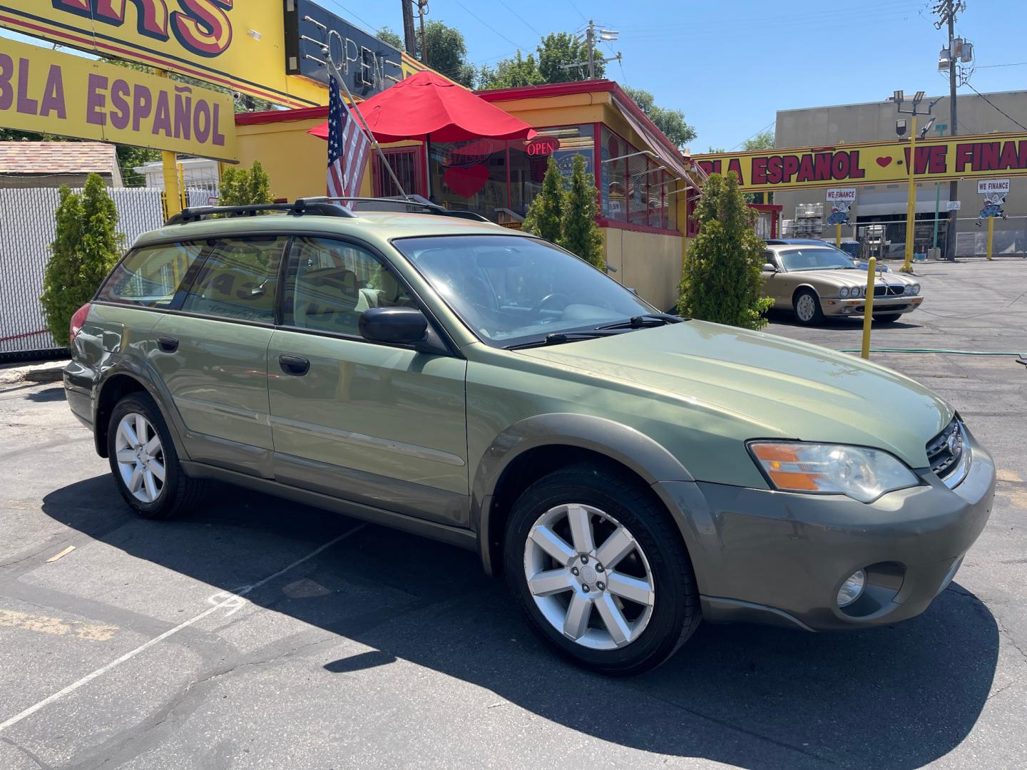 2007 Evergreen Frost Metallic /Tan Subaru Outback Crossover Wagon (4S4BP61CX77) with an 2.5L H4 engine, Automatic transmission, located at 801 South State Street, Salt Lake City, UT, 84111, (801) 328-0098, 40.751953, -111.888206 - Features: 4WD/AWD, Alloy Wheels, Cloth Seats, Front Seat Heaters, ABS Brakes, Auxiliary Audio Input, Overhead Airbags, Rear Defroster, AM/FM Stereo, CD Audio, Power Locks, Side Airbags, Air Conditioning, Cruise Control, Power Mirrors, Automatic Transmission, Full Roof Rack, Power Windows. - Photo#4