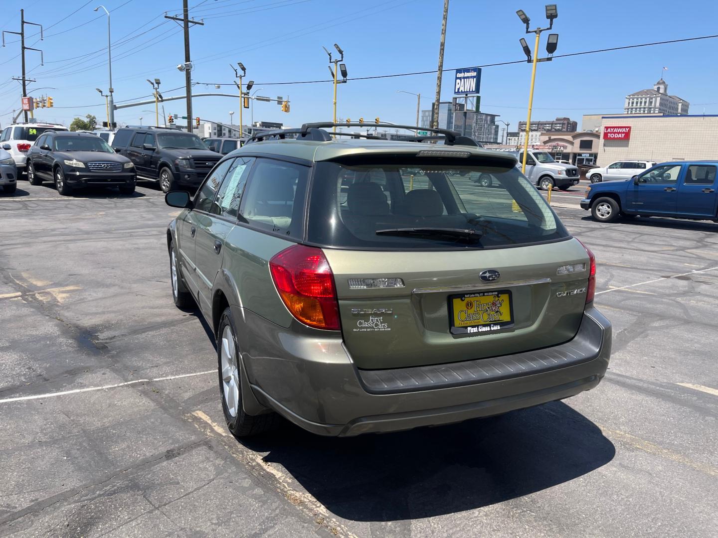 2007 Evergreen Frost Metallic /Tan Subaru Outback Crossover Wagon (4S4BP61CX77) with an 2.5L H4 engine, Automatic transmission, located at 801 South State Street, Salt Lake City, UT, 84111, (801) 328-0098, 40.751953, -111.888206 - Features: 4WD/AWD, Alloy Wheels, Cloth Seats, Front Seat Heaters, ABS Brakes, Auxiliary Audio Input, Overhead Airbags, Rear Defroster, AM/FM Stereo, CD Audio, Power Locks, Side Airbags, Air Conditioning, Cruise Control, Power Mirrors, Automatic Transmission, Full Roof Rack, Power Windows. - Photo#9