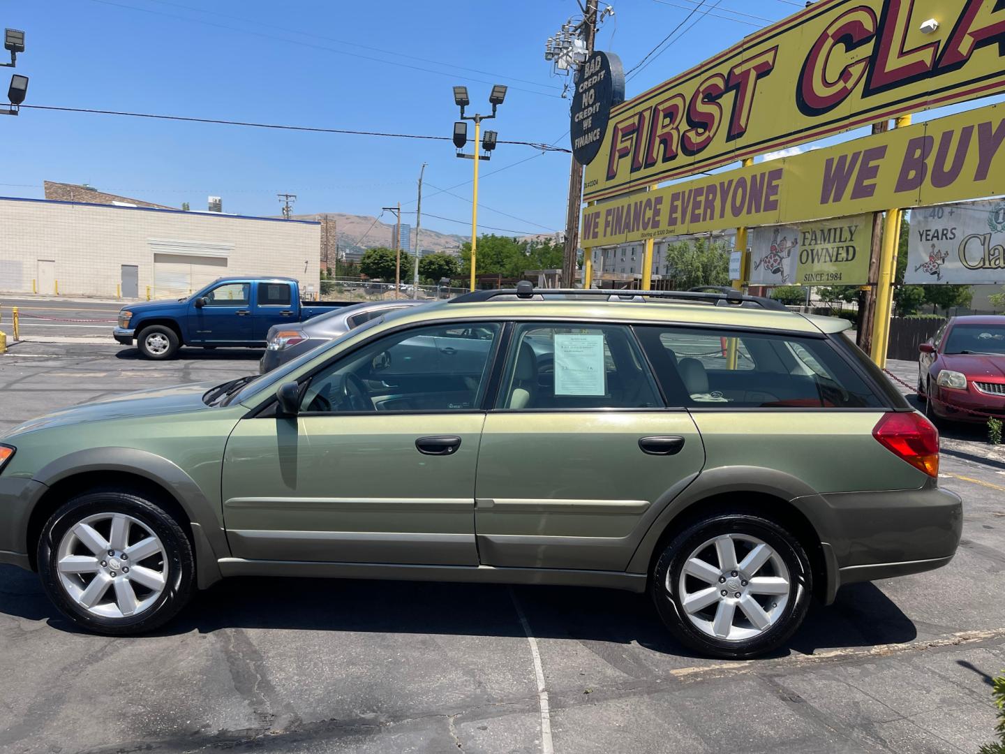 2007 Evergreen Frost Metallic /Tan Subaru Outback Crossover Wagon (4S4BP61CX77) with an 2.5L H4 engine, Automatic transmission, located at 801 South State Street, Salt Lake City, UT, 84111, (801) 328-0098, 40.751953, -111.888206 - Features: 4WD/AWD, Alloy Wheels, Cloth Seats, Front Seat Heaters, ABS Brakes, Auxiliary Audio Input, Overhead Airbags, Rear Defroster, AM/FM Stereo, CD Audio, Power Locks, Side Airbags, Air Conditioning, Cruise Control, Power Mirrors, Automatic Transmission, Full Roof Rack, Power Windows. - Photo#11
