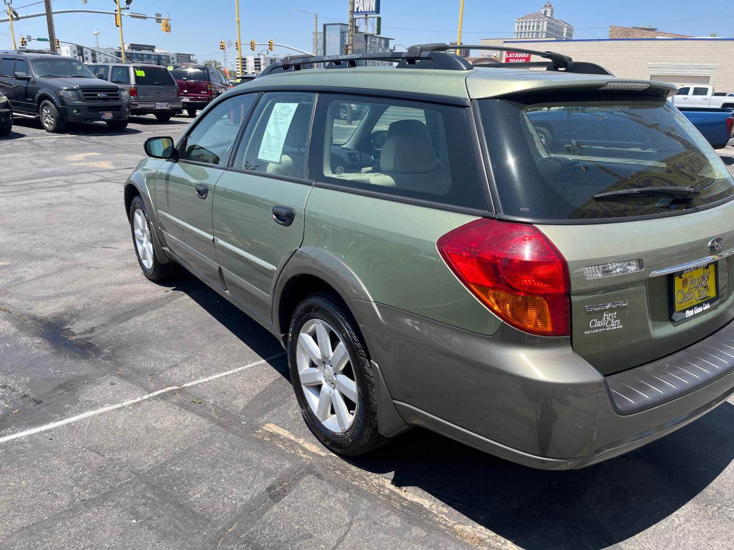 2007 Evergreen Frost Metallic /Tan Subaru Outback Crossover Wagon (4S4BP61CX77) with an 2.5L H4 engine, Automatic transmission, located at 801 South State Street, Salt Lake City, UT, 84111, (801) 328-0098, 40.751953, -111.888206 - Features: 4WD/AWD, Alloy Wheels, Cloth Seats, Front Seat Heaters, ABS Brakes, Auxiliary Audio Input, Overhead Airbags, Rear Defroster, AM/FM Stereo, CD Audio, Power Locks, Side Airbags, Air Conditioning, Cruise Control, Power Mirrors, Automatic Transmission, Full Roof Rack, Power Windows. - Photo#10