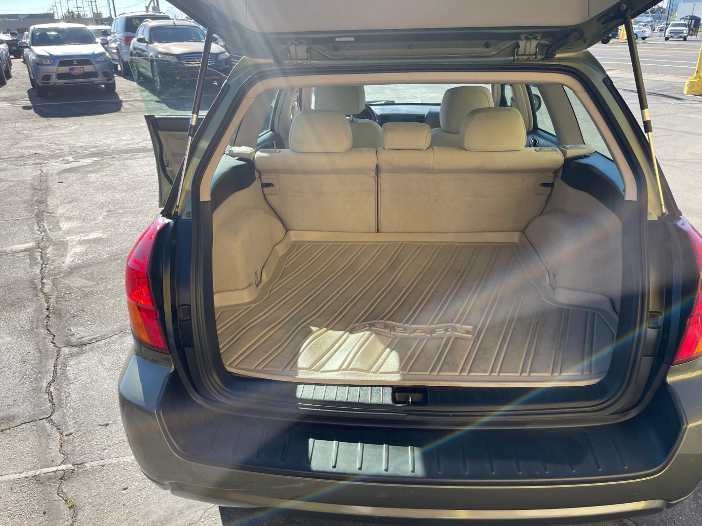 2007 Evergreen Frost Metallic /Tan Subaru Outback Crossover Wagon (4S4BP61CX77) with an 2.5L H4 engine, Automatic transmission, located at 801 South State Street, Salt Lake City, UT, 84111, (801) 328-0098, 40.751953, -111.888206 - Features: 4WD/AWD, Alloy Wheels, Cloth Seats, Front Seat Heaters, ABS Brakes, Auxiliary Audio Input, Overhead Airbags, Rear Defroster, AM/FM Stereo, CD Audio, Power Locks, Side Airbags, Air Conditioning, Cruise Control, Power Mirrors, Automatic Transmission, Full Roof Rack, Power Windows. - Photo#27