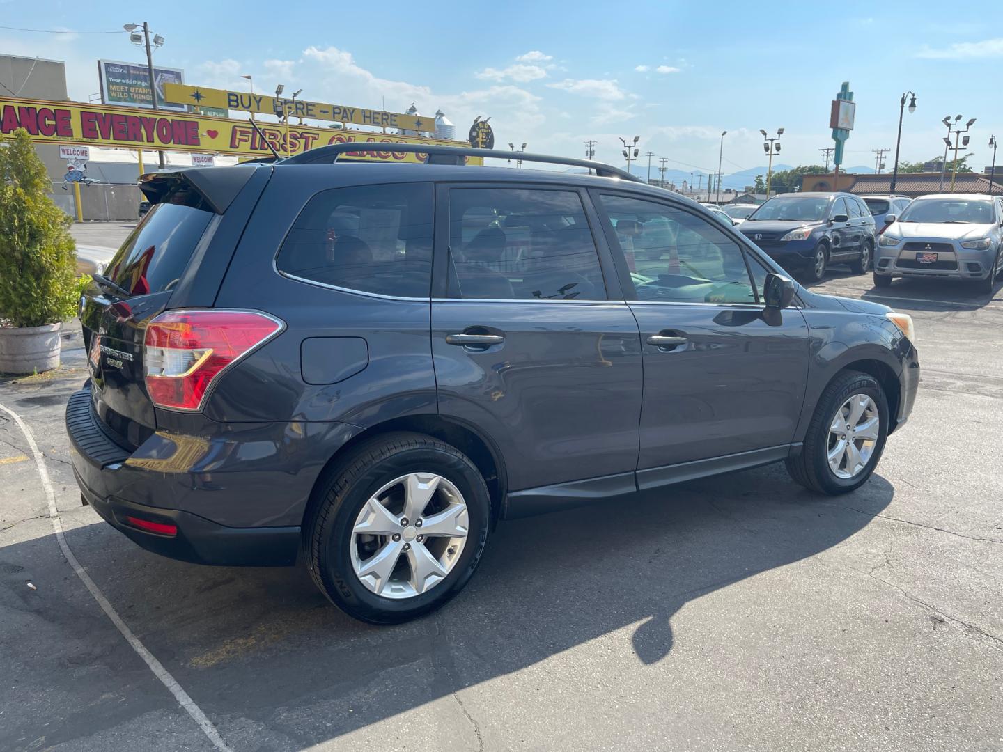 2014 Black Metallic /Tan Subaru Forester Limited X (JF2SJAHC6EH) with an 2.5L H4 engine, Automatic transmission, located at 801 South State Street, Salt Lake City, UT, 84111, (801) 328-0098, 40.751953, -111.888206 - Clean title! Only 2 owners on the Carfax history report. Features: AWD (All wheel Drive), Leather Seats, Bluetooth radio, touchscreen display, power seats, power sunroof, heated seats, power locks, power windows, power sunroof, Aux input, Alloy Wheels, Automatic, keyless entry, alarm, 2.5 liter, 4 - Photo#4