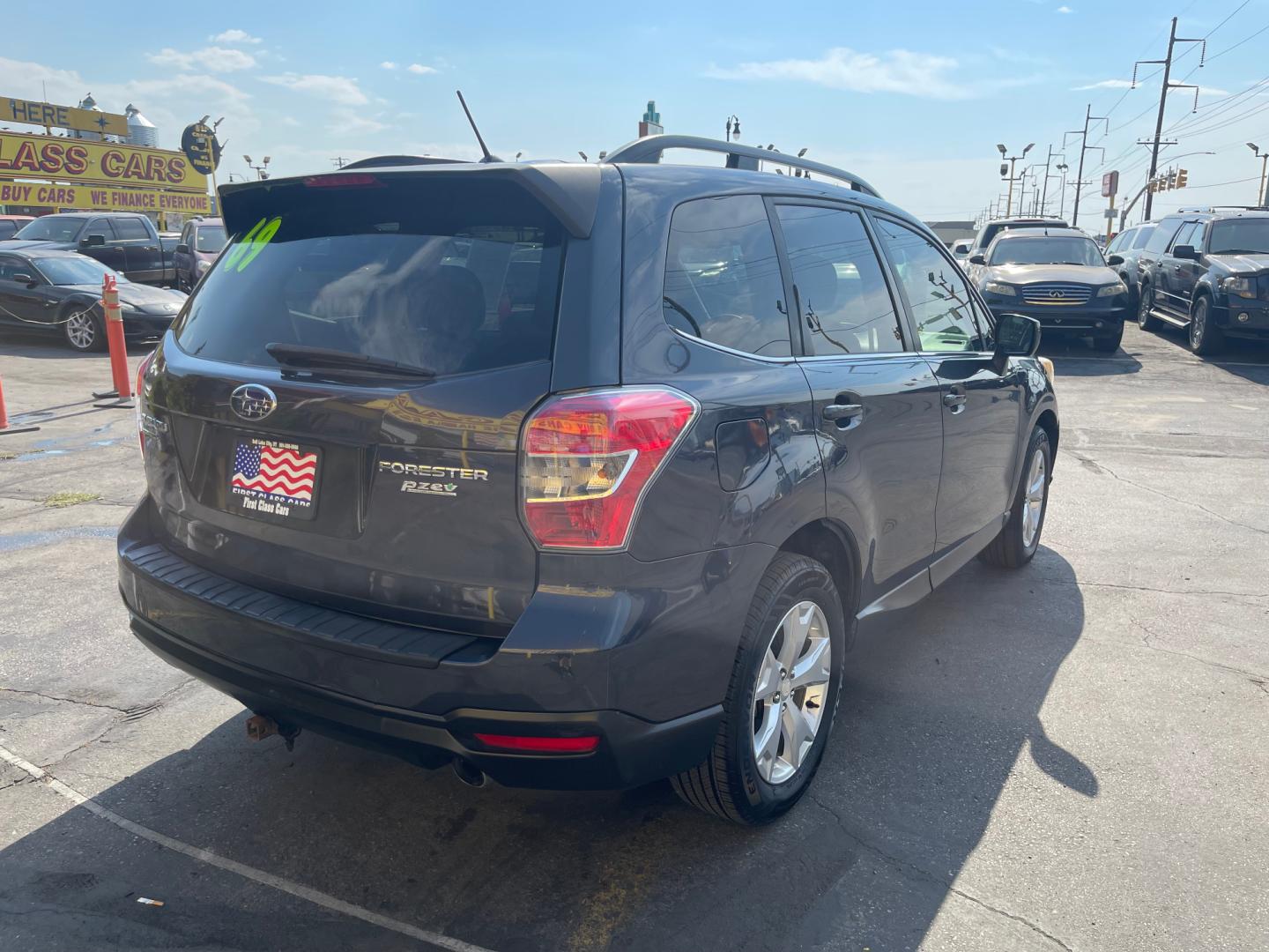 2014 Black Metallic /Tan Subaru Forester Limited X (JF2SJAHC6EH) with an 2.5L H4 engine, Automatic transmission, located at 801 South State Street, Salt Lake City, UT, 84111, (801) 328-0098, 40.751953, -111.888206 - Clean title! Only 2 owners on the Carfax history report. Features: AWD (All wheel Drive), Leather Seats, Bluetooth radio, touchscreen display, power seats, power sunroof, heated seats, power locks, power windows, power sunroof, Aux input, Alloy Wheels, Automatic, keyless entry, alarm, 2.5 liter, 4 - Photo#5