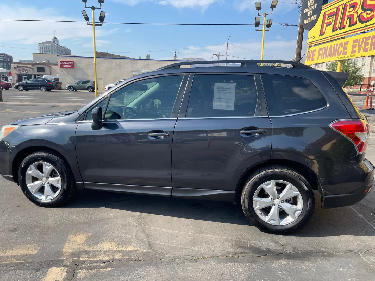 2014 Black Metallic /Tan Subaru Forester Limited X (JF2SJAHC6EH) with an 2.5L H4 engine, Automatic transmission, located at 801 South State Street, Salt Lake City, UT, 84111, (801) 328-0098, 40.751953, -111.888206 - Clean title! Only 2 owners on the Carfax history report. Features: AWD (All wheel Drive), Leather Seats, Bluetooth radio, touchscreen display, power seats, power sunroof, heated seats, power locks, power windows, power sunroof, Aux input, Alloy Wheels, Automatic, keyless entry, alarm, 2.5 liter, 4 - Photo#8