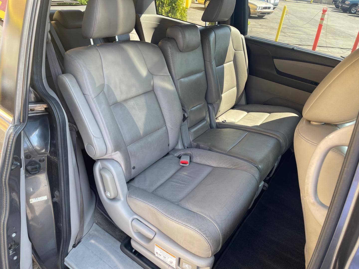 2013 Sterling Gray Metallic /Tan Honda Odyssey EX-L (5FNRL5H63DB) with an 3.5L V6 engine, Automatic transmission, located at 801 South State Street, Salt Lake City, UT, 84111, (801) 328-0098, 40.751953, -111.888206 - Clean title! 8 passenger van very clean condition! Easy clean leather interior! Features: Alloy Wheels, Rear Air Conditioning, Bluetooth Technology, Rear Sunshade, Fold-Away Third Row, Rear View Camera, Front Seat Heaters, Satellite Radio Ready, Leather Seats, Sunroof(s), Navigation System, Third - Photo#21