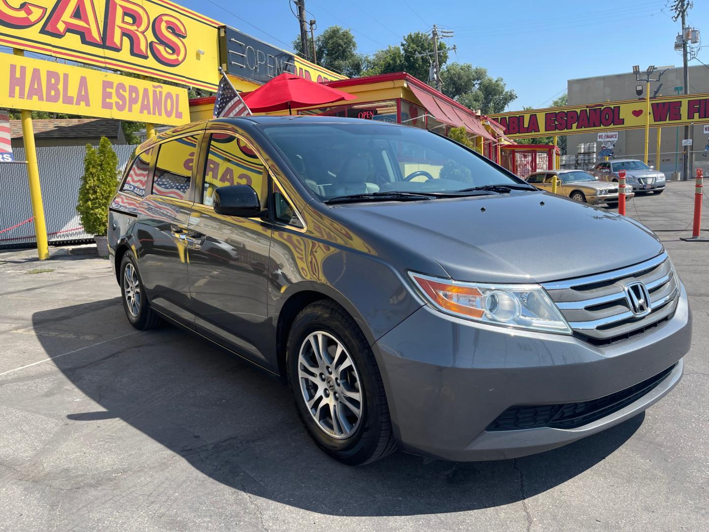 2013 Sterling Gray Metallic /Tan Honda Odyssey EX-L (5FNRL5H63DB) with an 3.5L V6 engine, Automatic transmission, located at 801 South State Street, Salt Lake City, UT, 84111, (801) 328-0098, 40.751953, -111.888206 - Clean title! 8 passenger van very clean condition! Easy clean leather interior! Features: Alloy Wheels, Rear Air Conditioning, Bluetooth Technology, Rear Sunshade, Fold-Away Third Row, Rear View Camera, Front Seat Heaters, Satellite Radio Ready, Leather Seats, Sunroof(s), Navigation System, Third - Photo#3