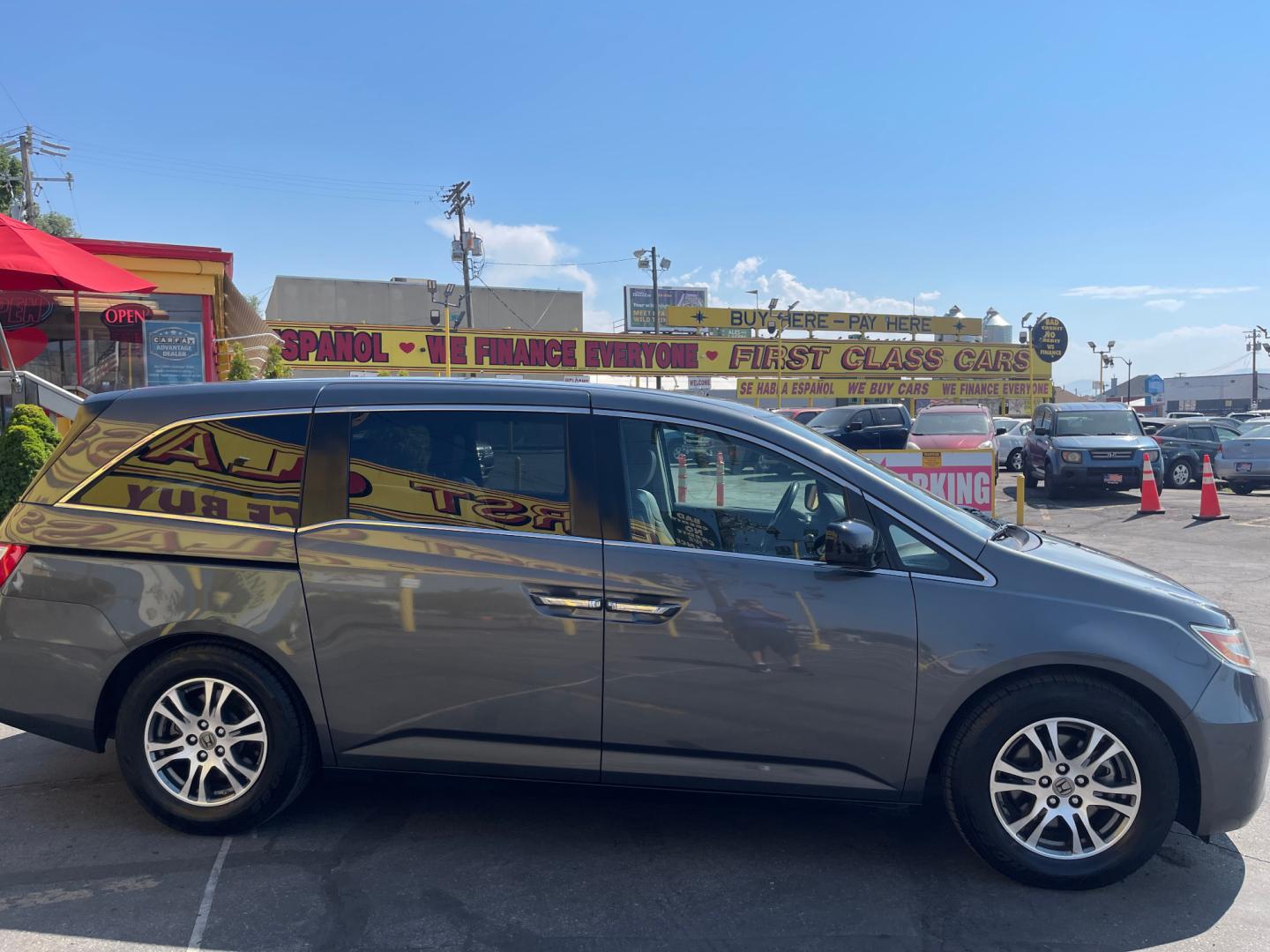 2013 Sterling Gray Metallic /Tan Honda Odyssey EX-L (5FNRL5H63DB) with an 3.5L V6 engine, Automatic transmission, located at 801 South State Street, Salt Lake City, UT, 84111, (801) 328-0098, 40.751953, -111.888206 - Clean title! 8 passenger van very clean condition! Easy clean leather interior! Features: Alloy Wheels, Rear Air Conditioning, Bluetooth Technology, Rear Sunshade, Fold-Away Third Row, Rear View Camera, Front Seat Heaters, Satellite Radio Ready, Leather Seats, Sunroof(s), Navigation System, Third - Photo#4