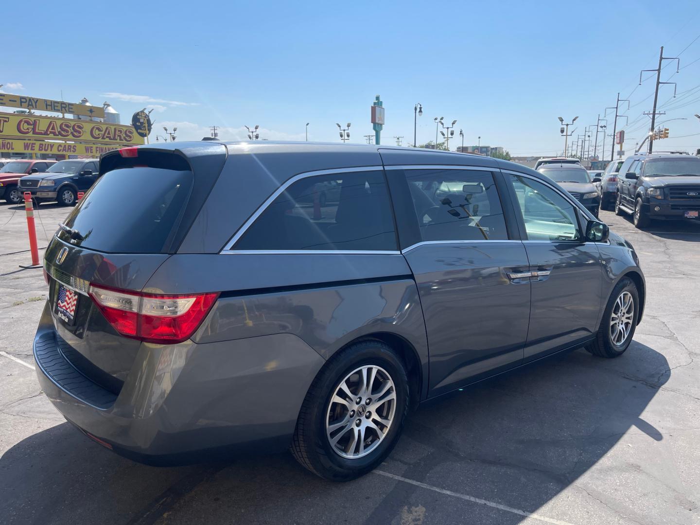 2013 Sterling Gray Metallic /Tan Honda Odyssey EX-L (5FNRL5H63DB) with an 3.5L V6 engine, Automatic transmission, located at 801 South State Street, Salt Lake City, UT, 84111, (801) 328-0098, 40.751953, -111.888206 - Clean title! 8 passenger van very clean condition! Easy clean leather interior! Features: Alloy Wheels, Rear Air Conditioning, Bluetooth Technology, Rear Sunshade, Fold-Away Third Row, Rear View Camera, Front Seat Heaters, Satellite Radio Ready, Leather Seats, Sunroof(s), Navigation System, Third - Photo#5