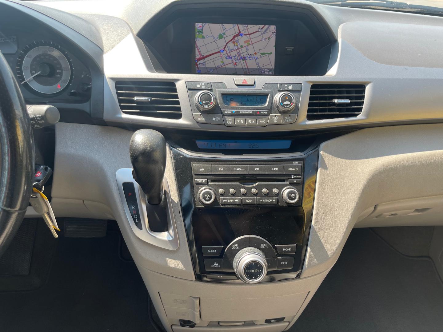 2013 Sterling Gray Metallic /Tan Honda Odyssey EX-L (5FNRL5H63DB) with an 3.5L V6 engine, Automatic transmission, located at 801 South State Street, Salt Lake City, UT, 84111, (801) 328-0098, 40.751953, -111.888206 - Clean title! 8 passenger van very clean condition! Easy clean leather interior! Features: Alloy Wheels, Rear Air Conditioning, Bluetooth Technology, Rear Sunshade, Fold-Away Third Row, Rear View Camera, Front Seat Heaters, Satellite Radio Ready, Leather Seats, Sunroof(s), Navigation System, Third - Photo#14