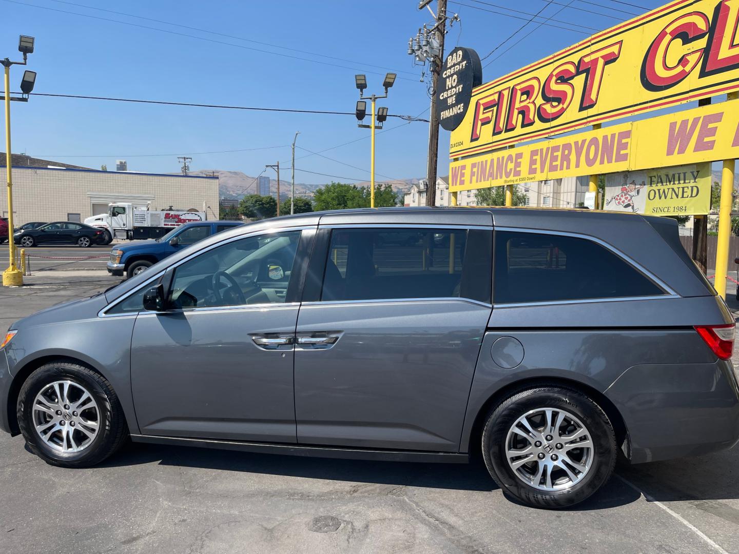 2013 Sterling Gray Metallic /Tan Honda Odyssey EX-L (5FNRL5H63DB) with an 3.5L V6 engine, Automatic transmission, located at 801 South State Street, Salt Lake City, UT, 84111, (801) 328-0098, 40.751953, -111.888206 - Clean title! 8 passenger van very clean condition! Easy clean leather interior! Features: Alloy Wheels, Rear Air Conditioning, Bluetooth Technology, Rear Sunshade, Fold-Away Third Row, Rear View Camera, Front Seat Heaters, Satellite Radio Ready, Leather Seats, Sunroof(s), Navigation System, Third - Photo#9