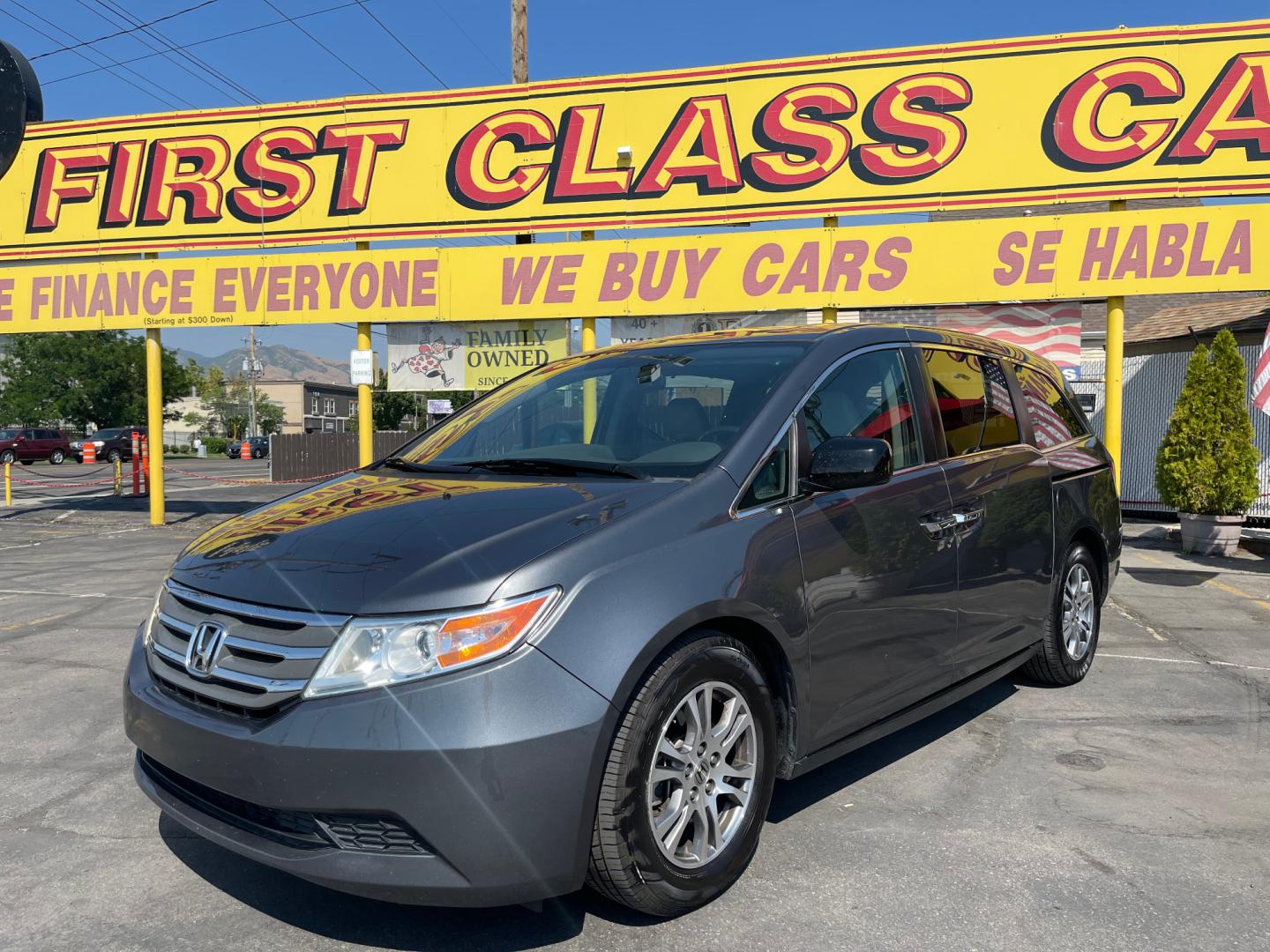 2013 Sterling Gray Metallic /Tan Honda Odyssey EX-L (5FNRL5H63DB) with an 3.5L V6 engine, Automatic transmission, located at 801 South State Street, Salt Lake City, UT, 84111, (801) 328-0098, 40.751953, -111.888206 - Clean title! 8 passenger van very clean condition! Easy clean leather interior! Features: Alloy Wheels, Rear Air Conditioning, Bluetooth Technology, Rear Sunshade, Fold-Away Third Row, Rear View Camera, Front Seat Heaters, Satellite Radio Ready, Leather Seats, Sunroof(s), Navigation System, Third - Photo#0