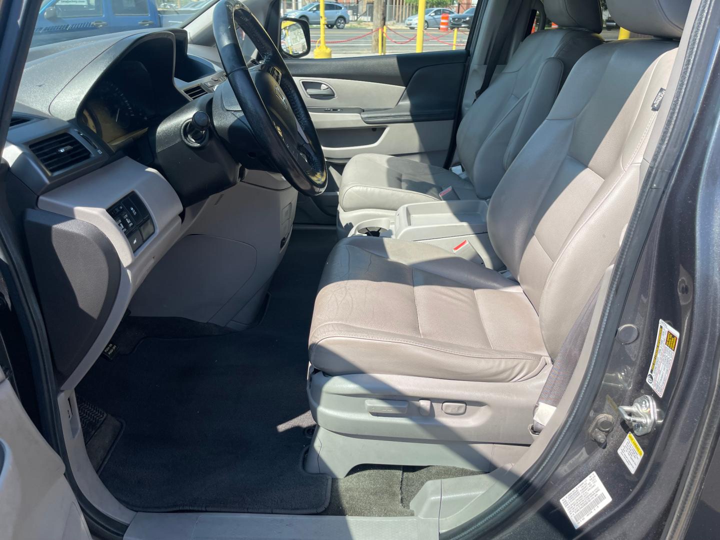 2013 Sterling Gray Metallic /Tan Honda Odyssey EX-L (5FNRL5H63DB) with an 3.5L V6 engine, Automatic transmission, located at 801 South State Street, Salt Lake City, UT, 84111, (801) 328-0098, 40.751953, -111.888206 - Clean title! 8 passenger van very clean condition! Easy clean leather interior! Features: Alloy Wheels, Rear Air Conditioning, Bluetooth Technology, Rear Sunshade, Fold-Away Third Row, Rear View Camera, Front Seat Heaters, Satellite Radio Ready, Leather Seats, Sunroof(s), Navigation System, Third - Photo#11