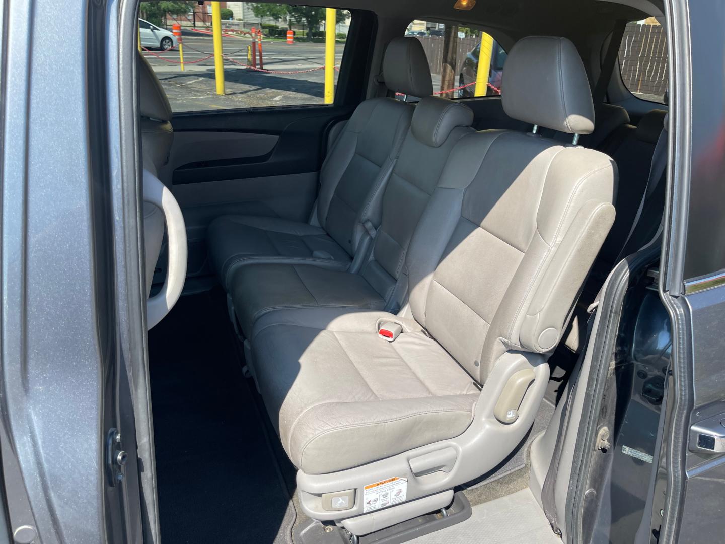 2013 Sterling Gray Metallic /Tan Honda Odyssey EX-L (5FNRL5H63DB) with an 3.5L V6 engine, Automatic transmission, located at 801 South State Street, Salt Lake City, UT, 84111, (801) 328-0098, 40.751953, -111.888206 - Clean title! 8 passenger van very clean condition! Easy clean leather interior! Features: Alloy Wheels, Rear Air Conditioning, Bluetooth Technology, Rear Sunshade, Fold-Away Third Row, Rear View Camera, Front Seat Heaters, Satellite Radio Ready, Leather Seats, Sunroof(s), Navigation System, Third - Photo#12