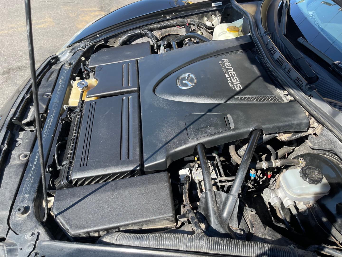 2010 Black Metallic /Black Mazda RX-8 RX8 Grand Touring (JM1FE1C43A0) with an 1.3L 4 Cylinder engine, Manual transmission, located at 801 South State Street, Salt Lake City, UT, 84111, (801) 328-0098, 40.751953, -111.888206 - Carfax 1 owner vehicle! Clean title no accidents on Carfax history report! Real clean in excellent condition for the year! Features: Alloy Wheels, Cloth Seats, ABS Brakes, CD Audio, Power Locks, Rear Spoiler, AM/FM Stereo, Cruise Control, Power Mirrors, Side Airbags, Air Conditioning, Manual Trans - Photo#22