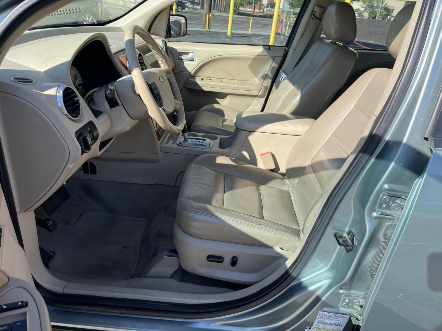 2005 Evergreen Frost Metallic /Tan Ford Freestyle Limited AWD (1FMDK06105G) with an 3.0L V6 DOHC 24V engine, Automatic CVT Overdrive transmission, located at 801 South State Street, Salt Lake City, UT, 84111, (801) 328-0098, 40.751953, -111.888206 - Clean title no reported accidents on Carfax history report. Very nice in great condition for the year and miles. It is in great shape inside and out! Features: 4WD/AWD, Memory Seat(s), Alloy Wheels, Parking Sensors, Fold-Away Third Row, Sunroof(s), Front Seat Heaters,Third Row Seat, Leather Seats, - Photo#12