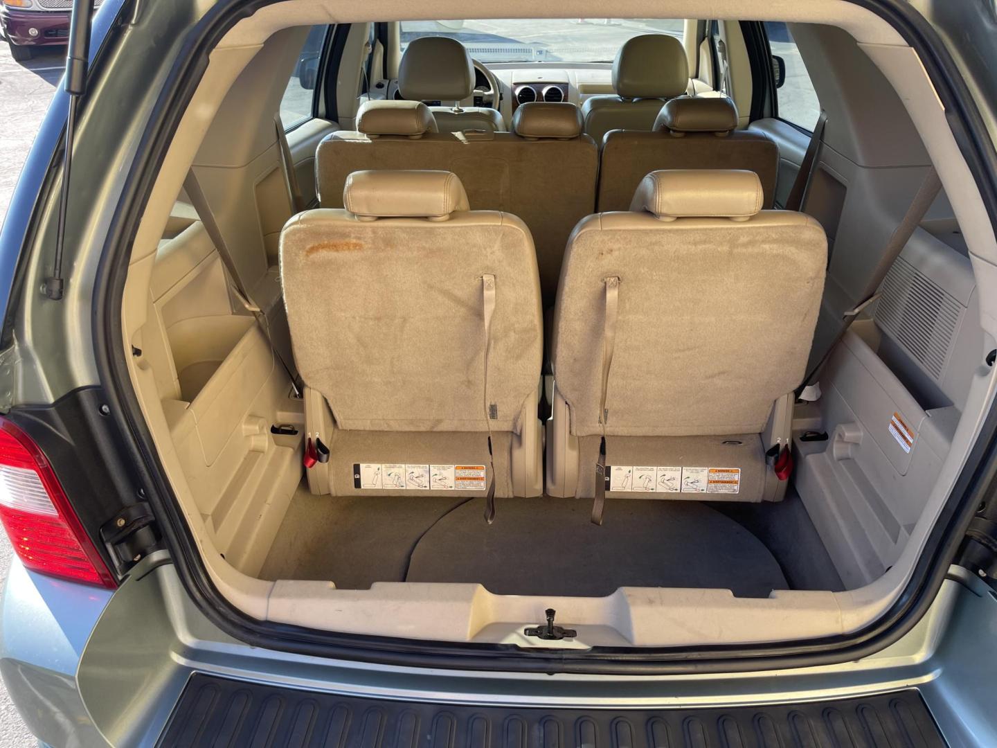 2005 Evergreen Frost Metallic /Tan Ford Freestyle Limited AWD (1FMDK06105G) with an 3.0L V6 DOHC 24V engine, Automatic CVT Overdrive transmission, located at 801 South State Street, Salt Lake City, UT, 84111, (801) 328-0098, 40.751953, -111.888206 - Clean title no reported accidents on Carfax history report. Very nice in great condition for the year and miles. It is in great shape inside and out! Features: 4WD/AWD, Memory Seat(s), Alloy Wheels, Parking Sensors, Fold-Away Third Row, Sunroof(s), Front Seat Heaters,Third Row Seat, Leather Seats, - Photo#25