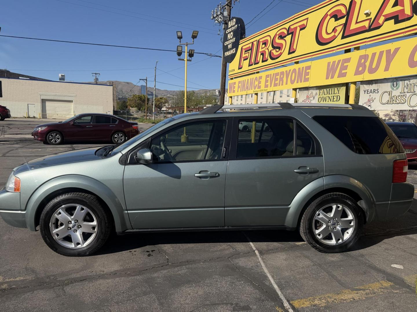 2005 Evergreen Frost Metallic /Tan Ford Freestyle Limited AWD (1FMDK06105G) with an 3.0L V6 DOHC 24V engine, Automatic CVT Overdrive transmission, located at 801 South State Street, Salt Lake City, UT, 84111, (801) 328-0098, 40.751953, -111.888206 - Clean title no reported accidents on Carfax history report. Very nice in great condition for the year and miles. It is in great shape inside and out! Comes with 3rd row seating! Passed all inspections through a certified mechanic and eligible for up to a 5 year warranty that can be added to the car. - Photo#8