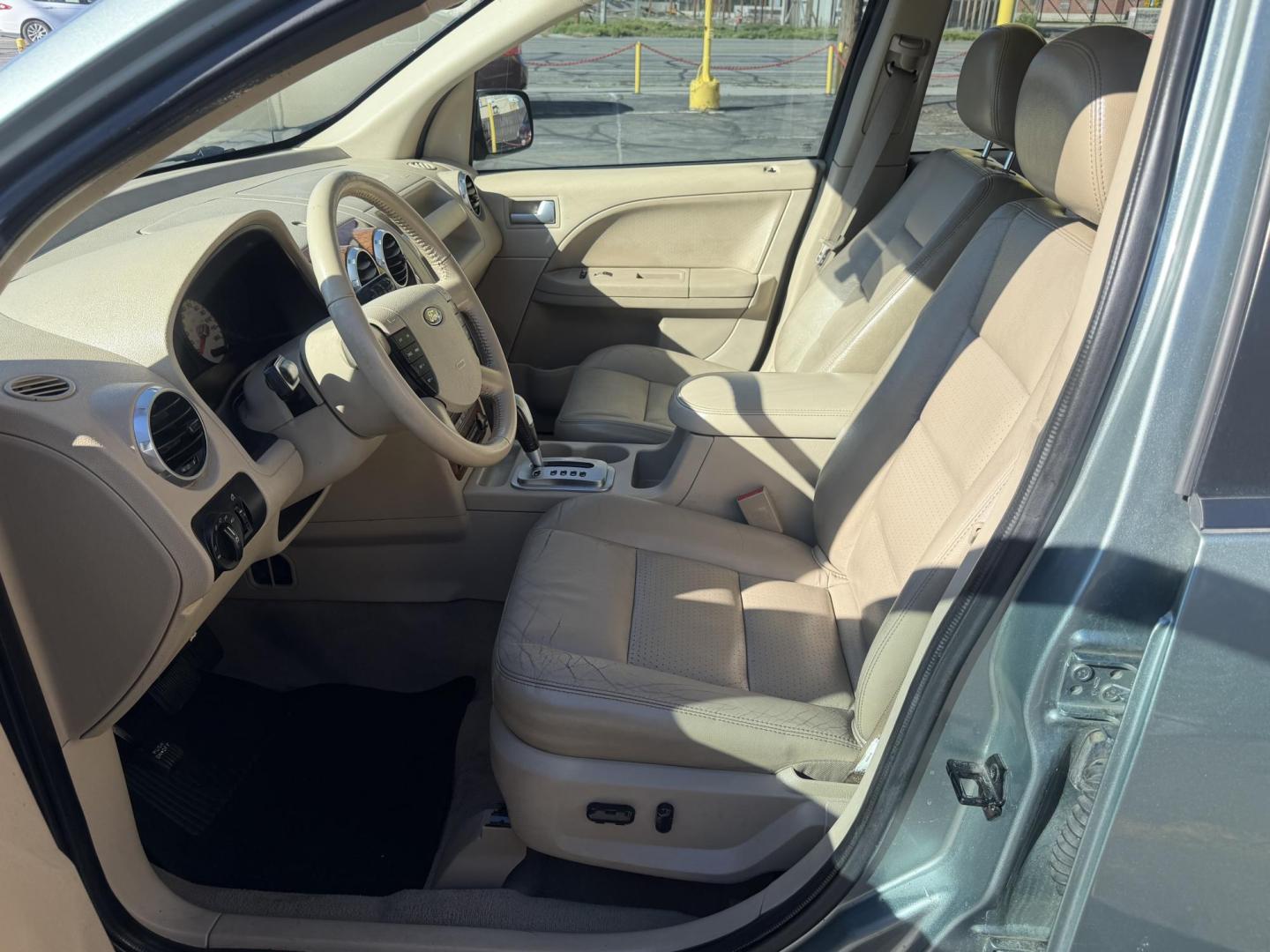 2005 Evergreen Frost Metallic /Tan Ford Freestyle Limited AWD (1FMDK06105G) with an 3.0L V6 DOHC 24V engine, Automatic CVT Overdrive transmission, located at 801 South State Street, Salt Lake City, UT, 84111, (801) 328-0098, 40.751953, -111.888206 - Clean title no reported accidents on Carfax history report. Very nice in great condition for the year and miles. It is in great shape inside and out! Comes with 3rd row seating! Passed all inspections through a certified mechanic and eligible for up to a 5 year warranty that can be added to the car. - Photo#11