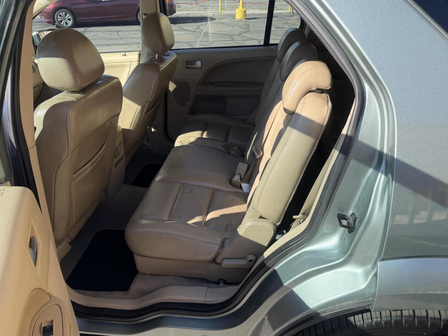 2005 Evergreen Frost Metallic /Tan Ford Freestyle Limited AWD (1FMDK06105G) with an 3.0L V6 DOHC 24V engine, Automatic CVT Overdrive transmission, located at 801 South State Street, Salt Lake City, UT, 84111, (801) 328-0098, 40.751953, -111.888206 - Clean title no reported accidents on Carfax history report. Very nice in great condition for the year and miles. It is in great shape inside and out! Comes with 3rd row seating! Passed all inspections through a certified mechanic and eligible for up to a 5 year warranty that can be added to the car. - Photo#12