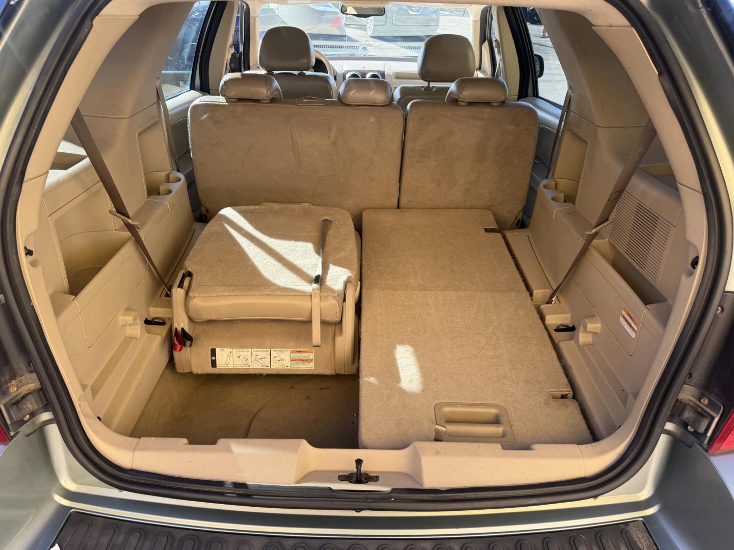 2005 Evergreen Frost Metallic /Tan Ford Freestyle Limited AWD (1FMDK06105G) with an 3.0L V6 DOHC 24V engine, Automatic CVT Overdrive transmission, located at 801 South State Street, Salt Lake City, UT, 84111, (801) 328-0098, 40.751953, -111.888206 - Clean title no reported accidents on Carfax history report. Very nice in great condition for the year and miles. It is in great shape inside and out! Comes with 3rd row seating! Passed all inspections through a certified mechanic and eligible for up to a 5 year warranty that can be added to the car. - Photo#21