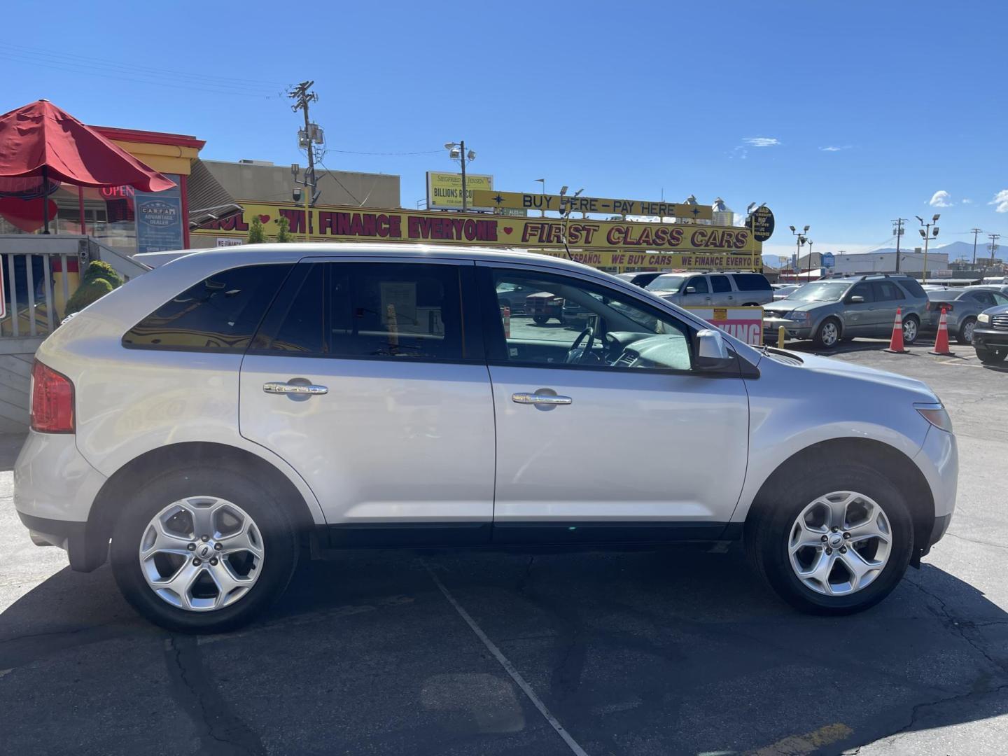 2011 Satin Silver Metallic /Black Ford Edge SEL FWD (2FMDK3JC2BB) with an 3.5L V6 DOHC 24V engine, 6-Speed Automatic transmission, located at 801 South State Street, Salt Lake City, UT, 84111, (801) 328-0098, 40.751953, -111.888206 - Clean Carfax no reported accidents on Carfax! Nice SUV! Features: Alloy Wheels, Parking Sensors, Bluetooth Technology, Satellite Radio Ready, Cloth Seats, SiriusXM Trial Available, ABS Brakes, Auxiliary Audio Input, Power Locks, Rear Defroster, AM/FM Stereo, CD Audio, Power Mirrors, Side Airbags, - Photo#7