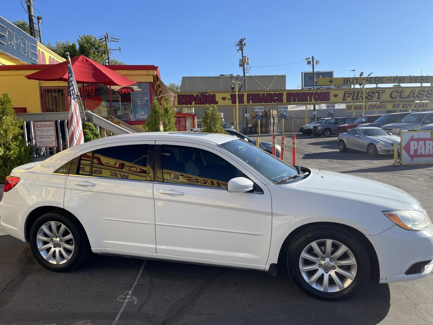 2013 Galaxy White /Black Chrysler 200 Touring (1C3CCBBG1DN) with an 3.6L V6 DOHC 24V FFV engine, 6-Speed Automatic transmission, located at 801 South State Street, Salt Lake City, UT, 84111, (801) 328-0098, 40.751953, -111.888206 - Clean title! No reported accidents on Carfax! Features: Alloy Wheels, Cloth Seats, Satellite Radio Ready, ABS Brakes, Auxiliary Audio Input, Power Locks, Rear Defroster, AM/FM Stereo, CD Audio, Power Mirrors, Side Airbags, Air Conditioning, Cruise Control, Power Seat(s), Traction Control, Automati - Photo#5