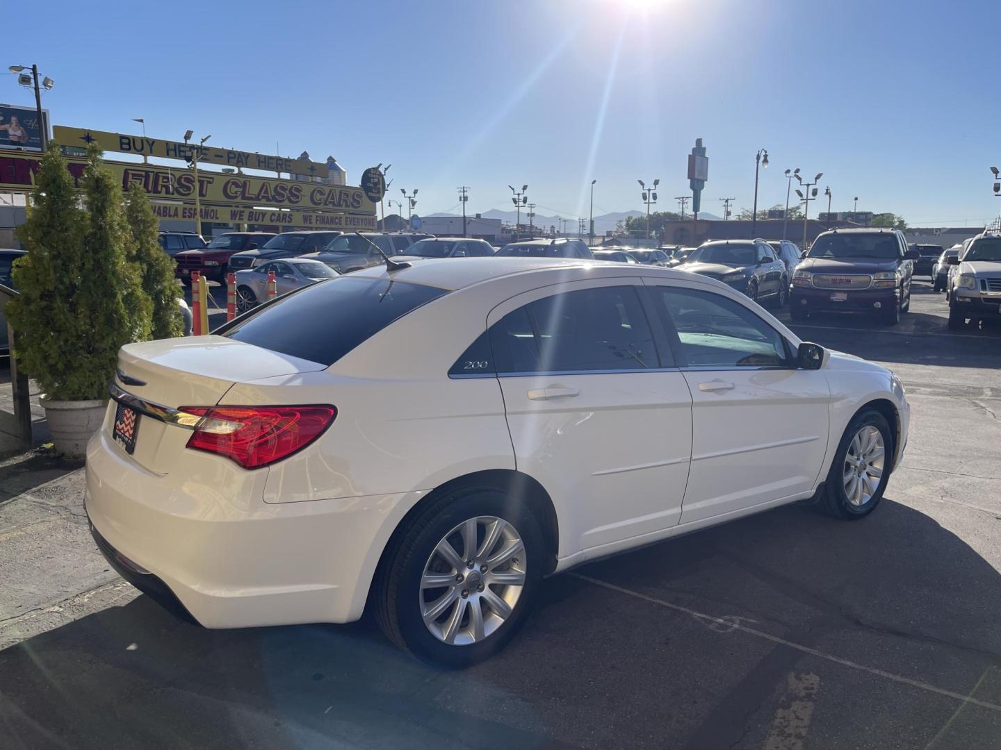 2013 Galaxy White /Black Chrysler 200 Touring (1C3CCBBG1DN) with an 3.6L V6 DOHC 24V FFV engine, 6-Speed Automatic transmission, located at 801 South State Street, Salt Lake City, UT, 84111, (801) 328-0098, 40.751953, -111.888206 - Clean title! No reported accidents on Carfax! Features: Alloy Wheels, Cloth Seats, Satellite Radio Ready, ABS Brakes, Auxiliary Audio Input, Power Locks, Rear Defroster, AM/FM Stereo, CD Audio, Power Mirrors, Side Airbags, Air Conditioning, Cruise Control, Power Seat(s), Traction Control, Automati - Photo#6