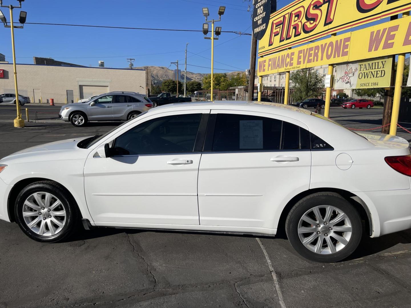 2013 Galaxy White /Black Chrysler 200 Touring (1C3CCBBG1DN) with an 3.6L V6 DOHC 24V FFV engine, 6-Speed Automatic transmission, located at 801 South State Street, Salt Lake City, UT, 84111, (801) 328-0098, 40.751953, -111.888206 - Clean title! No reported accidents on Carfax! Features: Alloy Wheels, Cloth Seats, Satellite Radio Ready, ABS Brakes, Auxiliary Audio Input, Power Locks, Rear Defroster, AM/FM Stereo, CD Audio, Power Mirrors, Side Airbags, Air Conditioning, Cruise Control, Power Seat(s), Traction Control, Automati - Photo#9