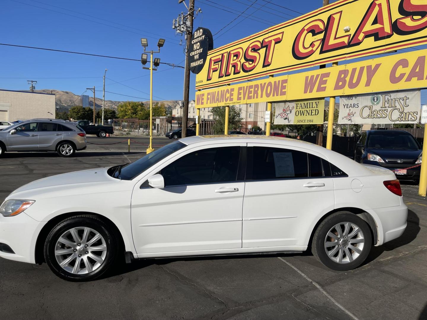 2013 Galaxy White /Black Chrysler 200 Touring (1C3CCBBG1DN) with an 3.6L V6 DOHC 24V FFV engine, 6-Speed Automatic transmission, located at 801 South State Street, Salt Lake City, UT, 84111, (801) 328-0098, 40.751953, -111.888206 - Clean title! No reported accidents on Carfax! Features: Alloy Wheels, Cloth Seats, Satellite Radio Ready, ABS Brakes, Auxiliary Audio Input, Power Locks, Rear Defroster, AM/FM Stereo, CD Audio, Power Mirrors, Side Airbags, Air Conditioning, Cruise Control, Power Seat(s), Traction Control, Automati - Photo#10