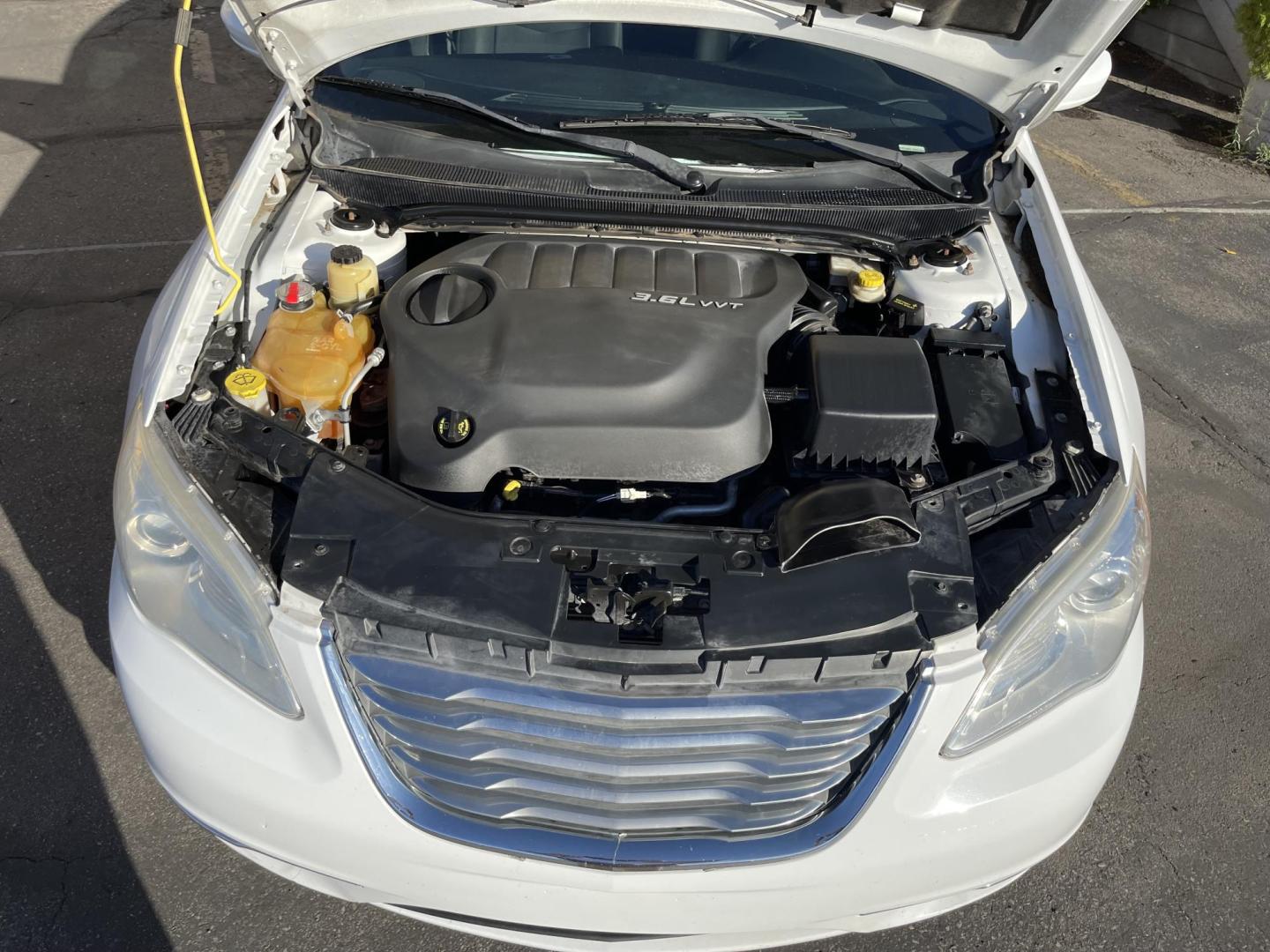 2013 Galaxy White /Black Chrysler 200 Touring (1C3CCBBG1DN) with an 3.6L V6 DOHC 24V FFV engine, 6-Speed Automatic transmission, located at 801 South State Street, Salt Lake City, UT, 84111, (801) 328-0098, 40.751953, -111.888206 - Clean title! No reported accidents on Carfax! Features: Alloy Wheels, Cloth Seats, Satellite Radio Ready, ABS Brakes, Auxiliary Audio Input, Power Locks, Rear Defroster, AM/FM Stereo, CD Audio, Power Mirrors, Side Airbags, Air Conditioning, Cruise Control, Power Seat(s), Traction Control, Automati - Photo#22