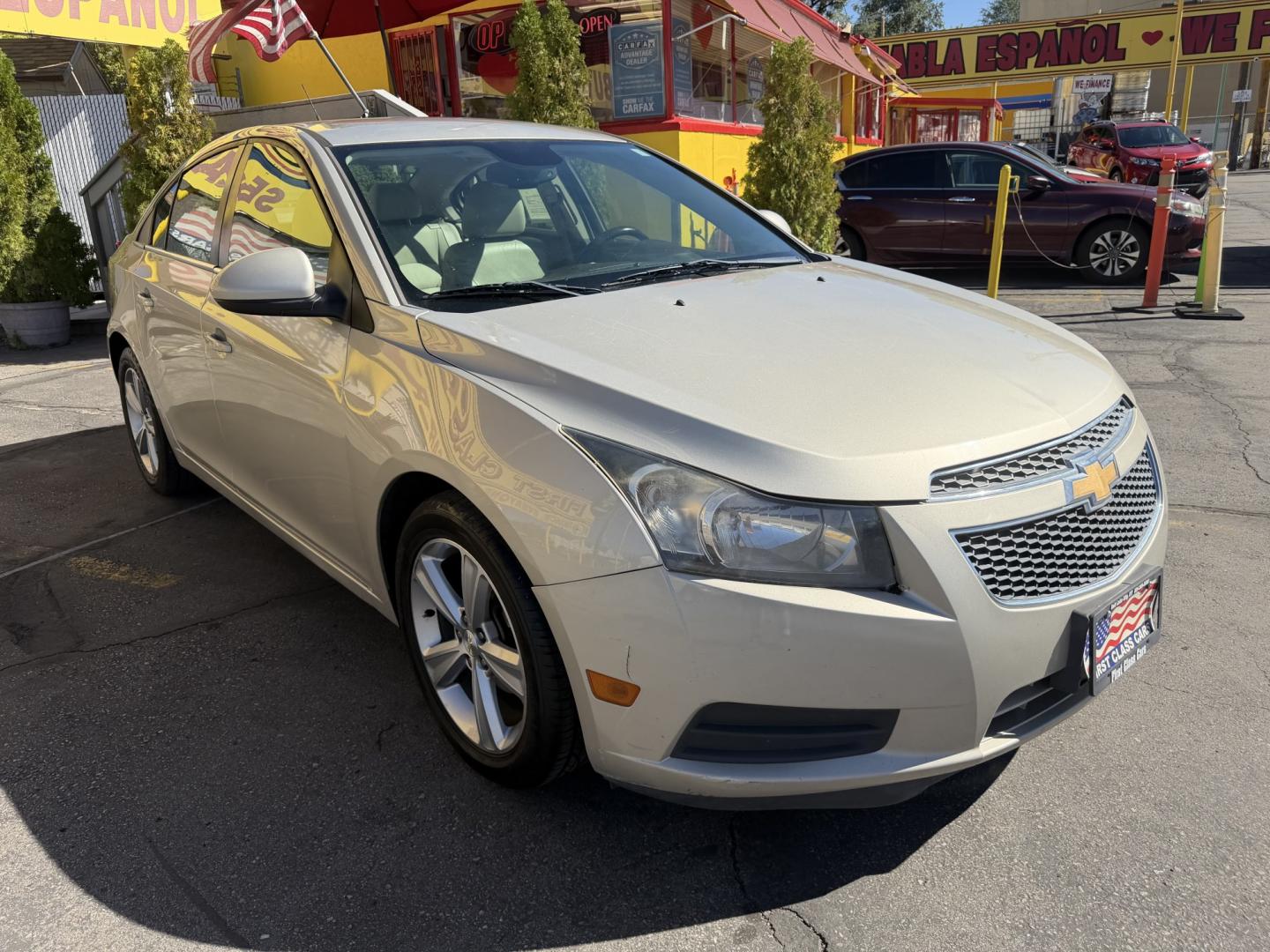 2013 Harvest Gold Metallic /Tan Chevrolet Cruze 2LT Auto (1G1PE5SB7D7) with an 1.4L L4 DOHC 16V TURBO engine, 6-Speed Automatic transmission, located at 801 South State Street, Salt Lake City, UT, 84111, (801) 328-0098, 40.751953, -111.888206 - Clean title! No reported accidents on Carfax! In great condition for the year make and miles. Low miles hard to find!!! Features: Leather Seats, Heated Seats, Alloy Wheels, Satellite Radio Ready, Bluetooth Technology, Turbo Charged Engine, Cloth Seats, ABS Brakes, Auxiliary Audio Input, Power Lock- Photo#3