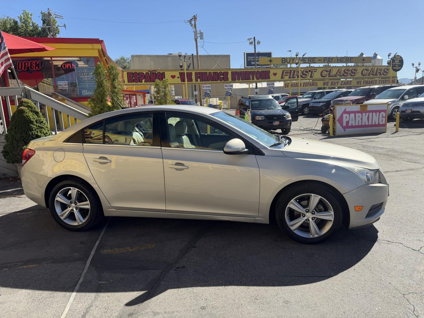 2013 Harvest Gold Metallic /Tan Chevrolet Cruze 2LT Auto (1G1PE5SB7D7) with an 1.4L L4 DOHC 16V TURBO engine, 6-Speed Automatic transmission, located at 801 South State Street, Salt Lake City, UT, 84111, (801) 328-0098, 40.751953, -111.888206 - Clean title! No reported accidents on Carfax! In great condition for the year make and miles. Low miles hard to find!!! Features: Leather Seats, Heated Seats, Alloy Wheels, Satellite Radio Ready, Bluetooth Technology, Turbo Charged Engine, Cloth Seats, ABS Brakes, Auxiliary Audio Input, Power Lock- Photo#4