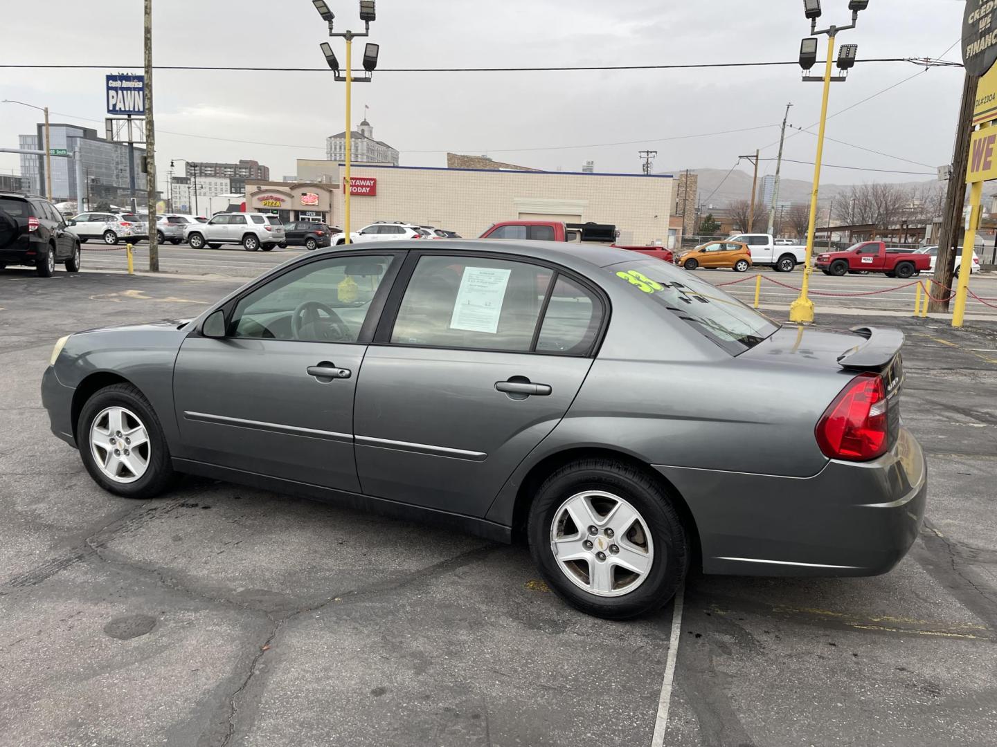 2005 Ingot Silver Metallic /Gray Chevrolet Malibu LS (1G1ZT52805F) with an 3.5L V6 OHV 12V engine, 4-Speed Automatic Overdrive transmission, located at 801 South State Street, Salt Lake City, UT, 84111, (801) 328-0098, 40.751953, -111.888206 - Clean title good reliable commuter vehicle for anyone looking for reliable transportation to go to and from work. Vehicle has passed emissions and ready to license. Features: 3.5 Liter V6 engine, Front wheel drive, automatic, power locks, power windows, cloth seats, am/fm/cd radio, power mirrors, - Photo#9