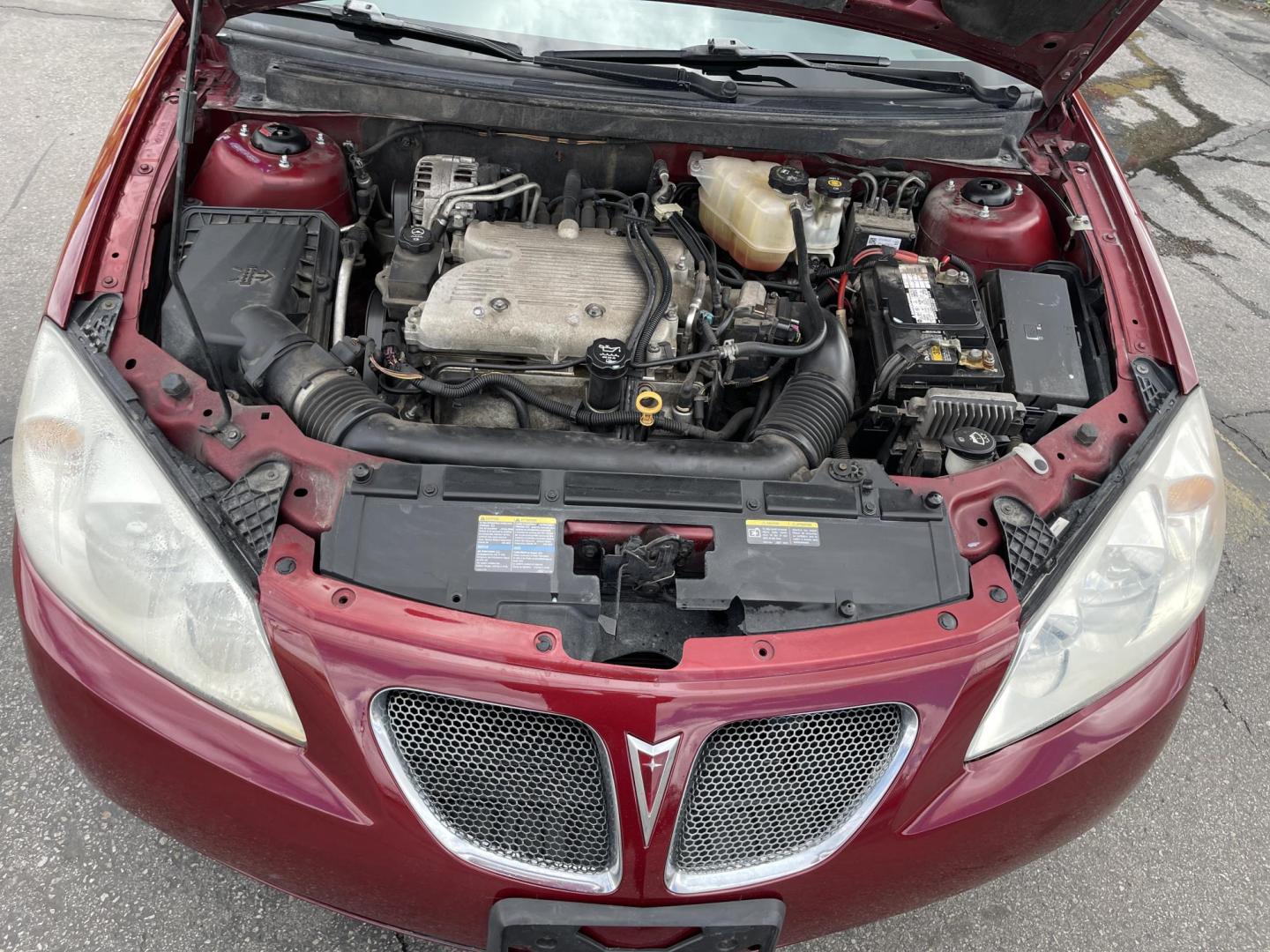 2008 Salsa Red Pearl /Black Pontiac G6 Sedan (1G2ZG57NX84) with an 3.5L V6 OHV 12V engine, 4-Speed Automatic Overdrive transmission, located at 801 South State Street, Salt Lake City, UT, 84111, (801) 328-0098, 40.751953, -111.888206 - Clean car! Clean title! Great commuter car for anyone looking for a good reliable affordable transportation to and from work! Features: Alloy Wheels, Cloth Seats, ABS Brakes, Auxiliary Audio Input, Power Locks, Rear Spoiler, AM/FM Stereo, CD Audio, Power Mirrors, Side Airbags, Air Conditioning, Cr - Photo#21
