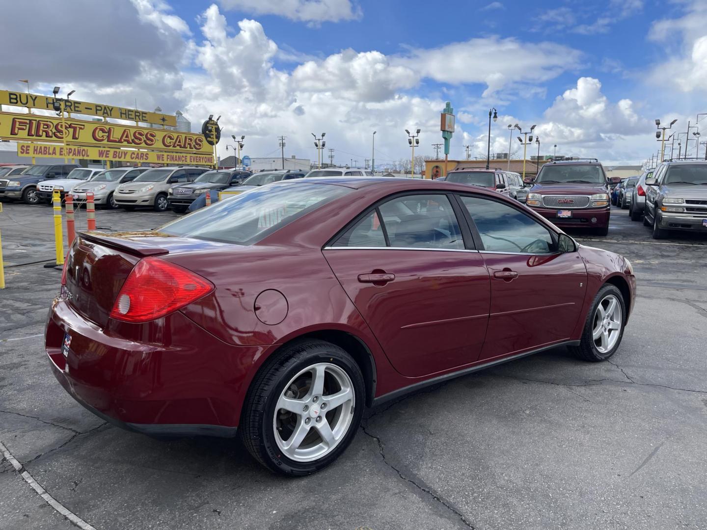 2008 Salsa Red Pearl /Black Pontiac G6 Sedan (1G2ZG57NX84) with an 3.5L V6 OHV 12V engine, 4-Speed Automatic Overdrive transmission, located at 801 South State Street, Salt Lake City, UT, 84111, (801) 328-0098, 40.751953, -111.888206 - Clean car! Clean title! Great commuter car for anyone looking for a good reliable affordable transportation to and from work! Features: Alloy Wheels, Cloth Seats, ABS Brakes, Auxiliary Audio Input, Power Locks, Rear Spoiler, AM/FM Stereo, CD Audio, Power Mirrors, Side Airbags, Air Conditioning, Cr - Photo#6