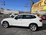 2013 Super White /Tan BMW X1 xDrive35i (WBAVM5C51DV) with an 3.0L L6 DOHC 24V engine, 6-Speed Automatic transmission, located at 801 South State Street, Salt Lake City, UT, 84111, (801) 328-0098, 40.751953, -111.888206 - Super clean immaculate condition inside and out! AWD great all year SUV! Clean title! Hard to find car! No accidents on Carfax! Only 2 previous owners! Originally from Florida according to Carfax it came to Utah with the second owner. Features: 4WD/AWD, Memory Seat(s), Alloy Wheels, Navigation Syst - Photo#9