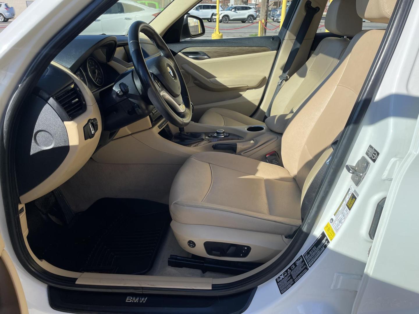 2013 Super White /Tan BMW X1 xDrive35i (WBAVM5C51DV) with an 3.0L L6 DOHC 24V engine, 6-Speed Automatic transmission, located at 801 South State Street, Salt Lake City, UT, 84111, (801) 328-0098, 40.751953, -111.888206 - Super clean immaculate condition inside and out! AWD great all year SUV! Clean title! Hard to find car! No accidents on Carfax! Only 2 previous owners! Originally from Florida according to Carfax it came to Utah with the second owner. Features: 4WD/AWD, Memory Seat(s), Alloy Wheels, Navigation Syst - Photo#11