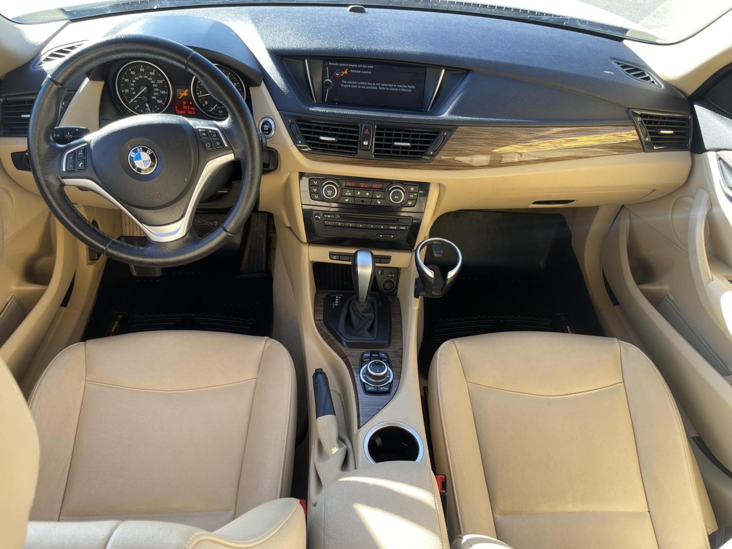 2013 Super White /Tan BMW X1 xDrive35i (WBAVM5C51DV) with an 3.0L L6 DOHC 24V engine, 6-Speed Automatic transmission, located at 801 South State Street, Salt Lake City, UT, 84111, (801) 328-0098, 40.751953, -111.888206 - Super clean immaculate condition inside and out! AWD great all year SUV! Clean title! Hard to find car! No accidents on Carfax! Only 2 previous owners! Originally from Florida according to Carfax it came to Utah with the second owner. Features: 4WD/AWD, Memory Seat(s), Alloy Wheels, Navigation Syst - Photo#16