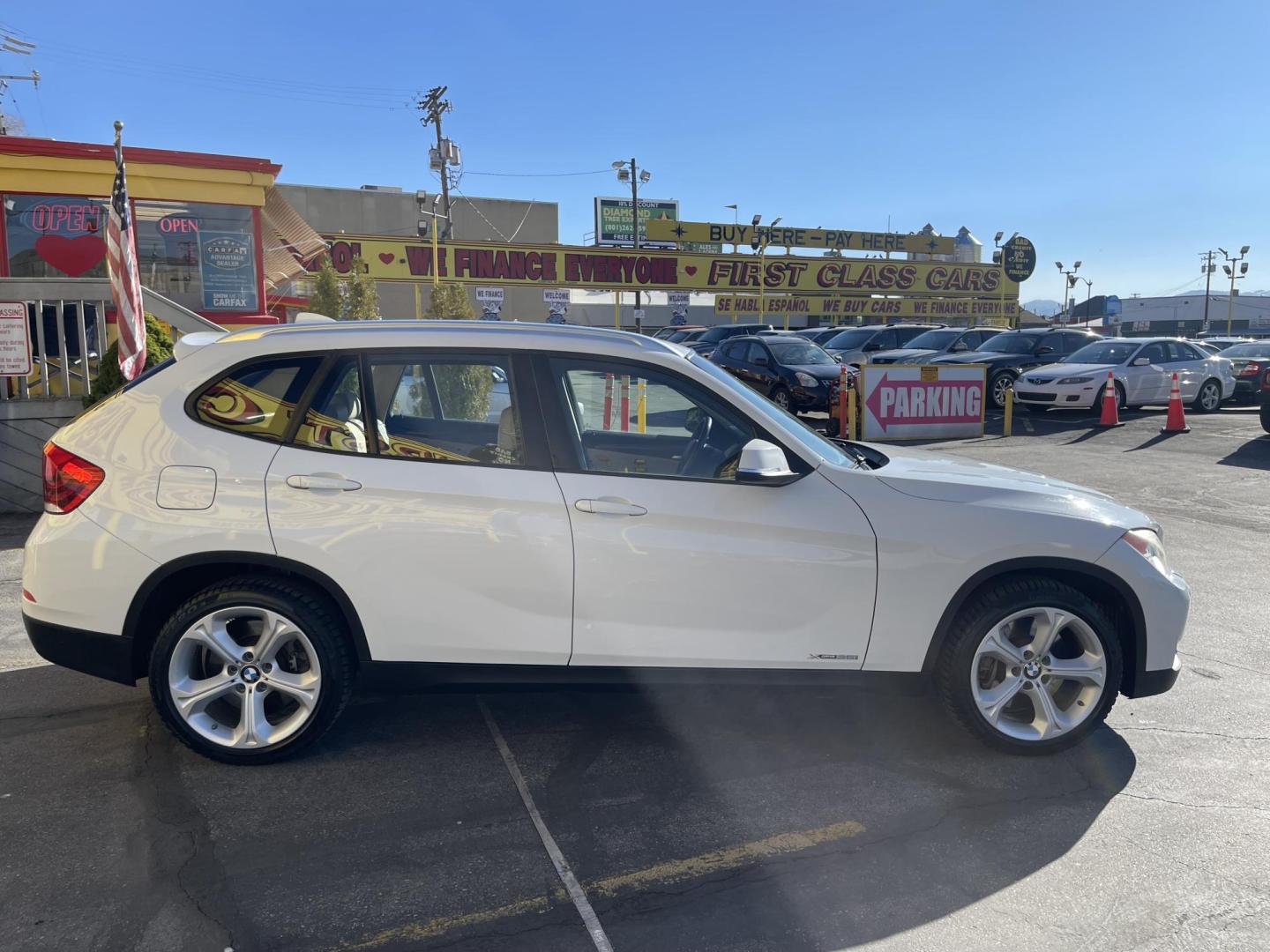 2013 Super White /Tan BMW X1 xDrive35i (WBAVM5C51DV) with an 3.0L L6 DOHC 24V engine, 6-Speed Automatic transmission, located at 801 South State Street, Salt Lake City, UT, 84111, (801) 328-0098, 40.751953, -111.888206 - Super clean immaculate condition inside and out! AWD great all year SUV! Clean title! Hard to find car! No accidents on Carfax! Only 2 previous owners! Originally from Florida according to Carfax it came to Utah with the second owner. Features: 4WD/AWD, Memory Seat(s), Alloy Wheels, Navigation Syst - Photo#5