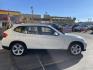 2013 Super White /Tan BMW X1 xDrive35i (WBAVM5C51DV) with an 3.0L L6 DOHC 24V engine, 6-Speed Automatic transmission, located at 801 South State Street, Salt Lake City, UT, 84111, (801) 328-0098, 40.751953, -111.888206 - Super clean immaculate condition inside and out! AWD great all year SUV! Clean title! Hard to find car! No accidents on Carfax! Only 2 previous owners! Originally from Florida according to Carfax it came to Utah with the second owner. Features: 4WD/AWD, Memory Seat(s), Alloy Wheels, Navigation Syst - Photo#5