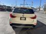 2013 Super White /Tan BMW X1 xDrive35i (WBAVM5C51DV) with an 3.0L L6 DOHC 24V engine, 6-Speed Automatic transmission, located at 801 South State Street, Salt Lake City, UT, 84111, (801) 328-0098, 40.751953, -111.888206 - Super clean immaculate condition inside and out! AWD great all year SUV! Clean title! Hard to find car! No accidents on Carfax! Only 2 previous owners! Originally from Florida according to Carfax it came to Utah with the second owner. Features: 4WD/AWD, Memory Seat(s), Alloy Wheels, Navigation Syst - Photo#7