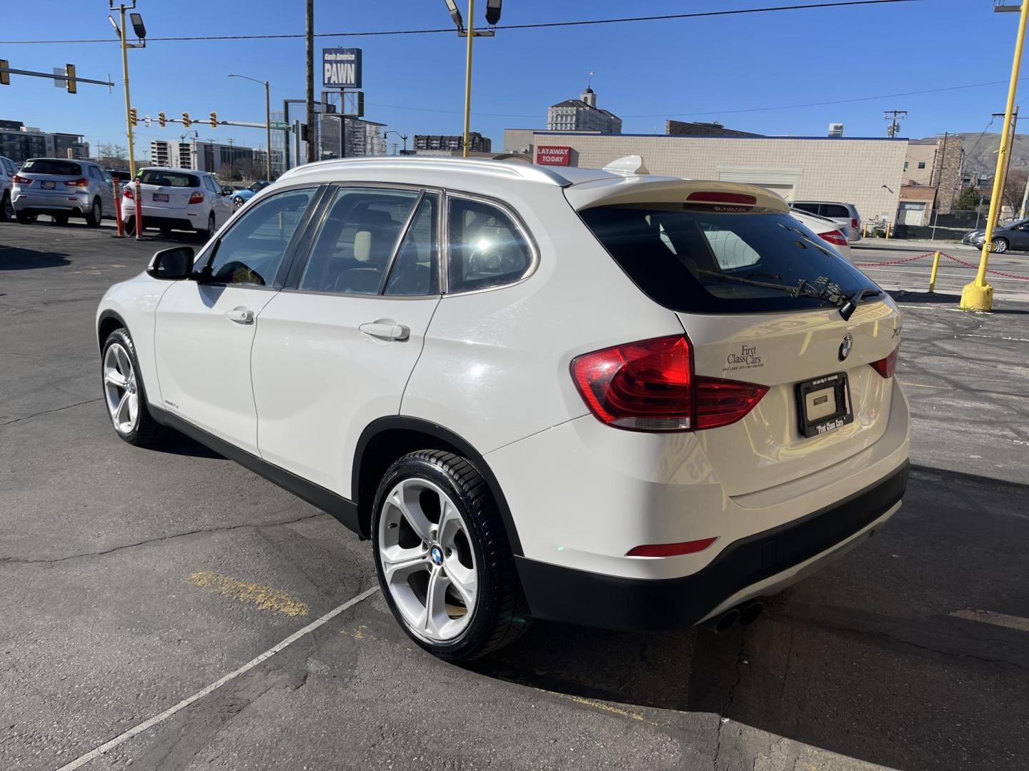 2013 Super White /Tan BMW X1 xDrive35i (WBAVM5C51DV) with an 3.0L L6 DOHC 24V engine, 6-Speed Automatic transmission, located at 801 South State Street, Salt Lake City, UT, 84111, (801) 328-0098, 40.751953, -111.888206 - Super clean immaculate condition inside and out! AWD great all year SUV! Clean title! Hard to find car! No accidents on Carfax! Only 2 previous owners! Originally from Florida according to Carfax it came to Utah with the second owner. Features: 4WD/AWD, Memory Seat(s), Alloy Wheels, Navigation Syst - Photo#8
