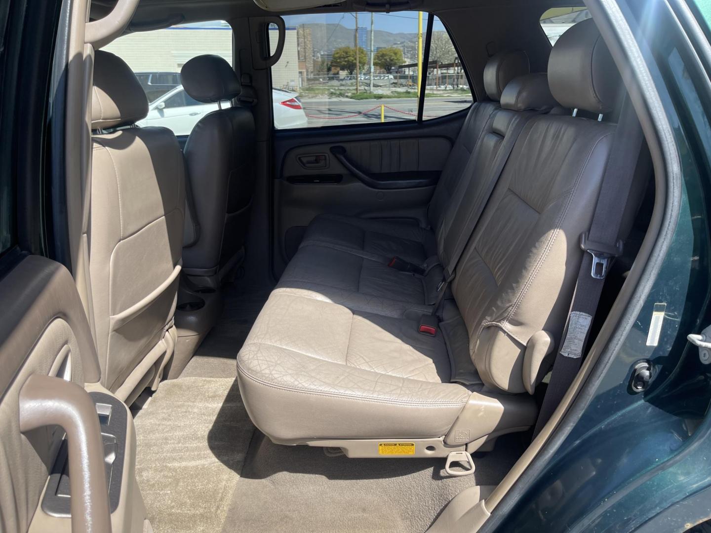 2004 Emerald Green /Tan Toyota Sequoia Limited 4WD (5TDBT48A44S) with an 4.7L V8 DOHC 32V engine, 4-Speed Automatic Overdrive transmission, located at 801 South State Street, Salt Lake City, UT, 84111, (801) 328-0098, 40.751953, -111.888206 - Clean title! No accidents on Carfax! Hard to find Sequoia with 4x4! Real nice 3rd row seating perfect family vehicle!!! Features: 20 Inch Plus Wheels, Rear Air Conditioning, 4WD/AWD, Rear Entertainment System, Alloy Wheels, Running Boards, Front Seat Heaters, Sunroof(s), JBL Sound System, Third Row - Photo#13