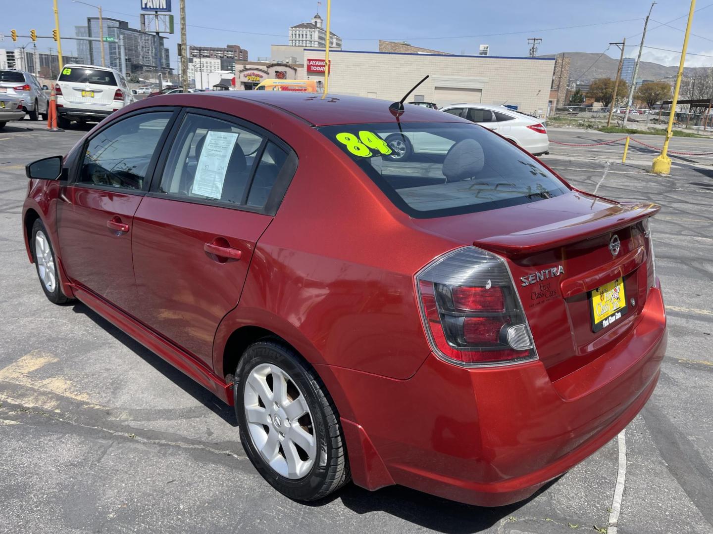 2011 Flame Red /Gray Nissan Sentra 2.0 (3N1AB6AP9BL) with an 2.0L L4 DOHC 16V engine, Continuously Variable Transmisson transmission, located at 801 South State Street, Salt Lake City, UT, 84111, (801) 328-0098, 40.751953, -111.888206 - Clean title! Low Miles! No accidents on the Carfax vehicle history report, Only 99k miles just over, good gas mileage! Perfect commuter car!!! Features: Alloy Wheels, Cloth Seats, ABS Brakes, Auxiliary Audio Input, Power Locks, Rear Spoiler, AM/FM Stereo, CD Audio, Power Mirrors, Side Airbags, Air - Photo#8