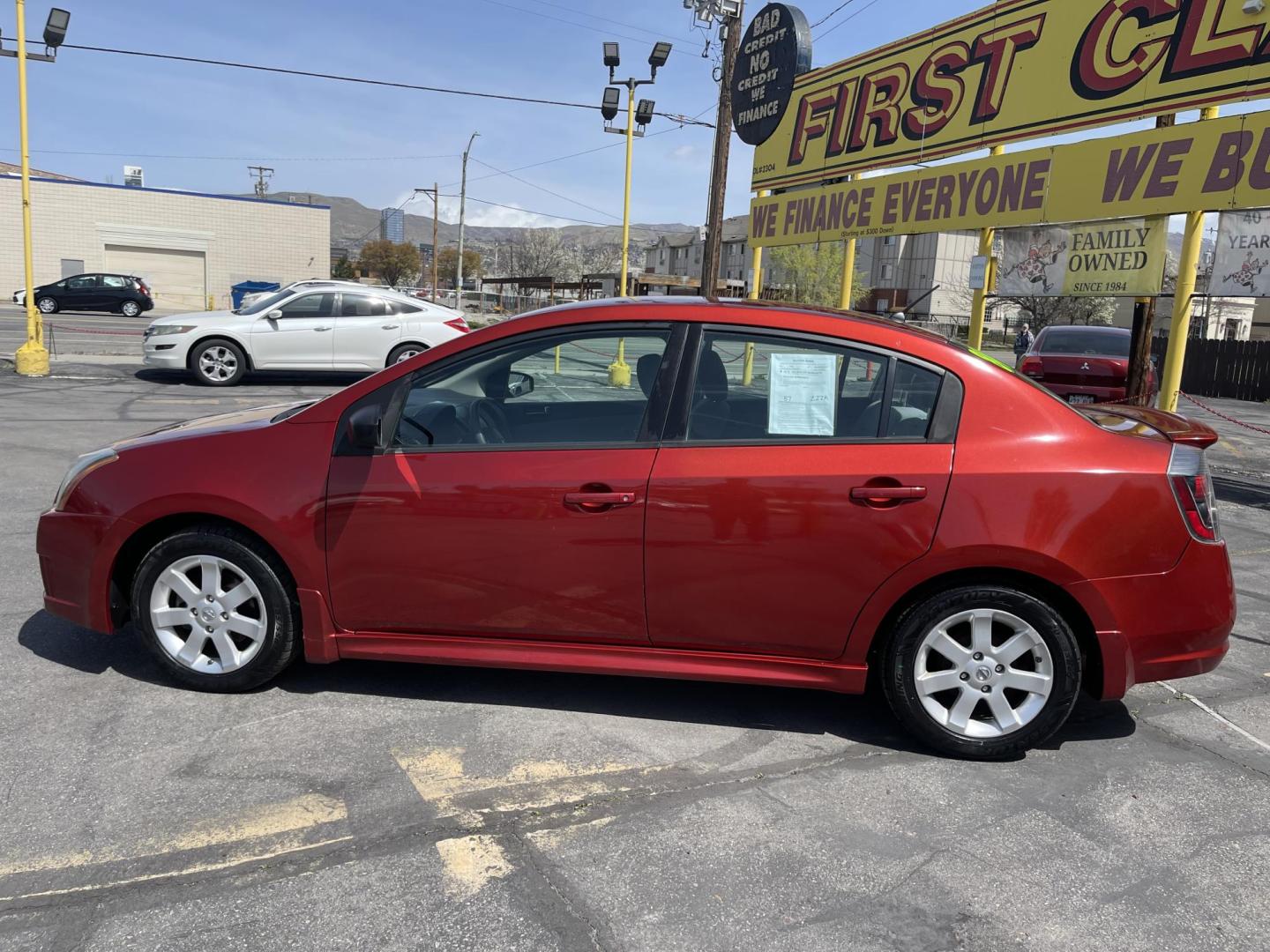 2011 Flame Red /Gray Nissan Sentra 2.0 (3N1AB6AP9BL) with an 2.0L L4 DOHC 16V engine, Continuously Variable Transmisson transmission, located at 801 South State Street, Salt Lake City, UT, 84111, (801) 328-0098, 40.751953, -111.888206 - Clean title! Low Miles! No accidents on the Carfax vehicle history report, Only 99k miles just over, good gas mileage! Perfect commuter car!!! Features: Alloy Wheels, Cloth Seats, ABS Brakes, Auxiliary Audio Input, Power Locks, Rear Spoiler, AM/FM Stereo, CD Audio, Power Mirrors, Side Airbags, Air - Photo#9