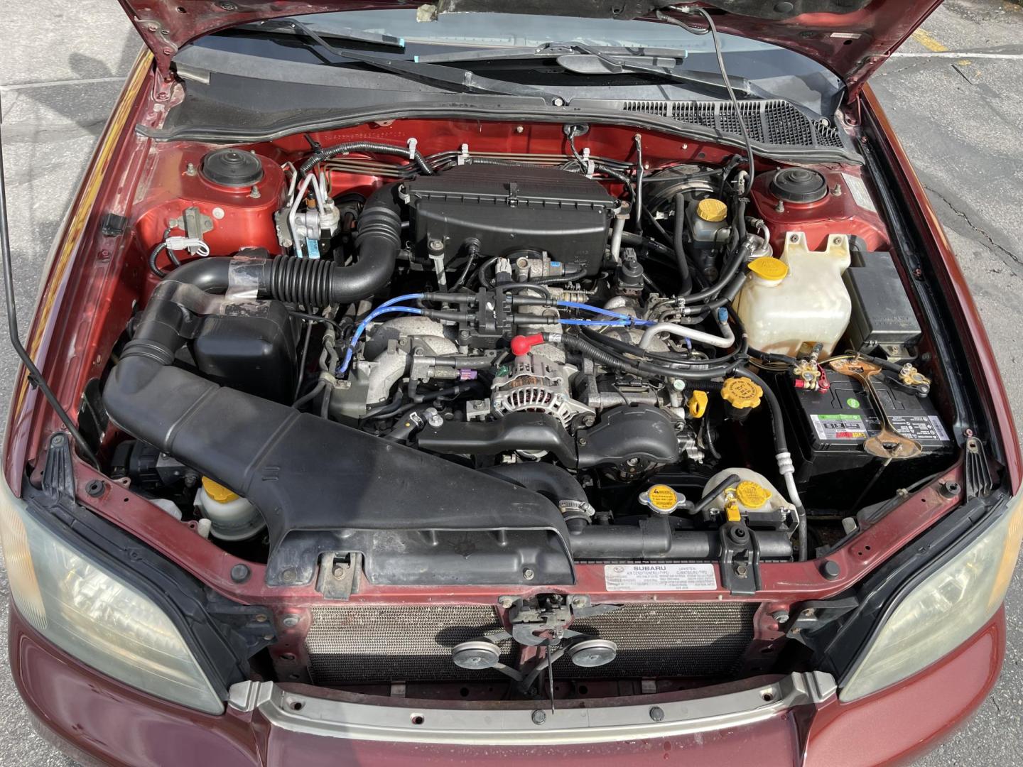 2003 Rallye Red /Tan Subaru Outback Wagon w/ All-weather Package (4S3BH675837) with an 2.5L H4 SOHC 16V engine, 4-Speed Automatic Overdrive transmission, located at 801 South State Street, Salt Lake City, UT, 84111, (801) 328-0098, 40.751953, -111.888206 - AWD! 2.5Liter 4 cylinder good on gas! Clean title! No accidents on Carfax, vehicle has a clean Carfax and has been meticulously maintained according to Carfax over 68 service records reported to Carfax that include maintenance, oil changes timing belt and several other records!!! Features: AWD, Pow - Photo#16