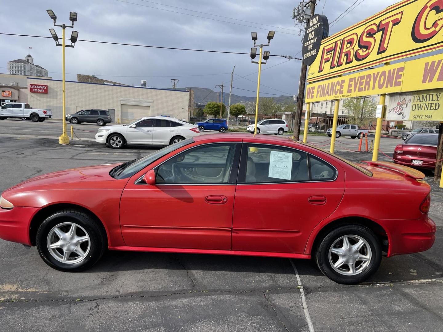 2000 Rallye Red /BROWN Oldsmobile Alero GL1 Sedan (1G3NL52T3YC) with an 2.4L L4 DOHC 16V engine, 5-Speed Manual Overdrive transmission, located at 801 South State Street, Salt Lake City, UT, 84111, (801) 328-0098, 40.751953, -111.888206 - Features: Automatic, power locks, power windows, power seat, alloy wheels, am/fm/cd, cloth interior, 4 cylinder 2.4 liter motor, electronic defrost, * All advertised prices are just dollars above cost to make room for new inventory these are our cash prices plus taxes, licensing and dealer fees. A - Photo#8