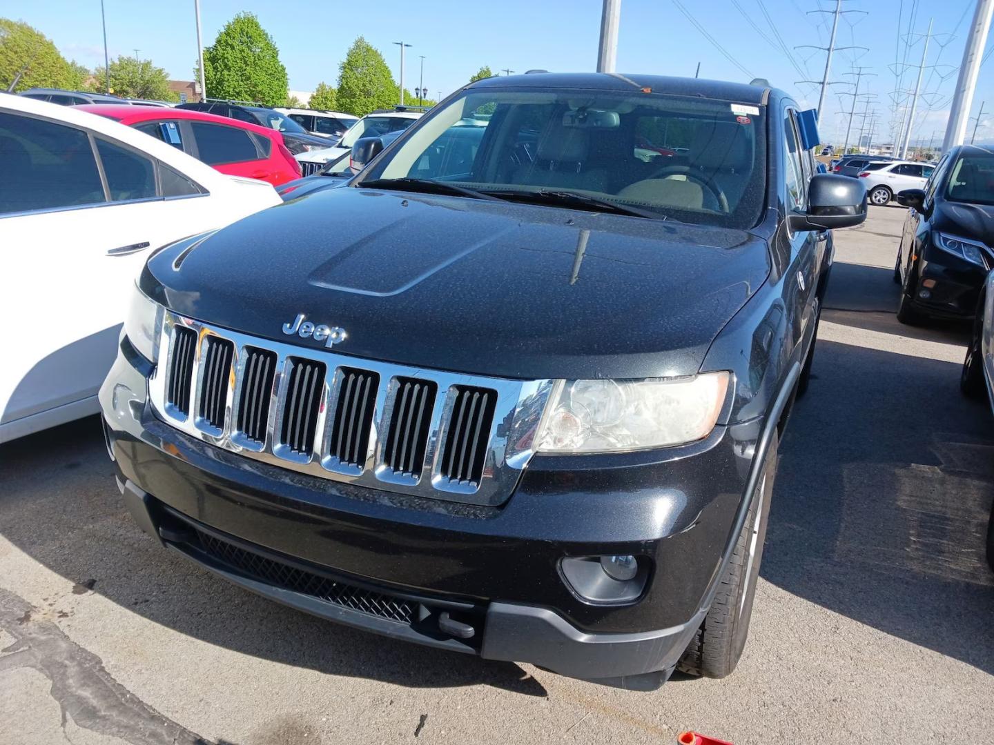 2012 Black /Tan Jeep Grand Cherokee Laredo 4WD (1C4RJFAG9CC) with an 3.6L V6 DOHC 24V engine, 5-Speed Automatic transmission, located at 801 South State Street, Salt Lake City, UT, 84111, (801) 328-0098, 40.751953, -111.888206 - Clean title! Clean car inside and out this vehicle looks immaculate! A must see for anyone looking for a nice Jeep! Vehicle is 4x4 great for winter and all season weather! All around clean SUV hard to find in this price range this clean! Features: 4WD/AWD, Leather Seats, Alloy Wheels, Navigation S - Photo#1