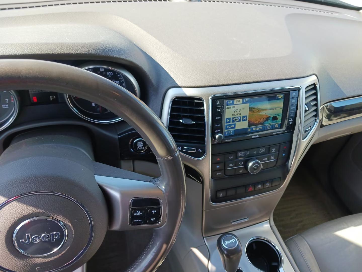 2012 Black /Tan Jeep Grand Cherokee Laredo 4WD (1C4RJFAG9CC) with an 3.6L V6 DOHC 24V engine, 5-Speed Automatic transmission, located at 801 South State Street, Salt Lake City, UT, 84111, (801) 328-0098, 40.751953, -111.888206 - Clean title! Clean car inside and out this vehicle looks immaculate! A must see for anyone looking for a nice Jeep! Vehicle is 4x4 great for winter and all season weather! All around clean SUV hard to find in this price range this clean! Features: 4WD/AWD, Leather Seats, Alloy Wheels, Navigation S - Photo#3