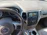 2012 Black /Tan Jeep Grand Cherokee Laredo 4WD (1C4RJFAG9CC) with an 3.6L V6 DOHC 24V engine, 5-Speed Automatic transmission, located at 801 South State Street, Salt Lake City, UT, 84111, (801) 328-0098, 40.751953, -111.888206 - Clean title! Clean car inside and out this vehicle looks immaculate! A must see for anyone looking for a nice Jeep! Vehicle is 4x4 great for winter and all season weather! All around clean SUV hard to find in this price range this clean! Features: 4WD/AWD, Leather Seats, Alloy Wheels, Navigation S - Photo#3